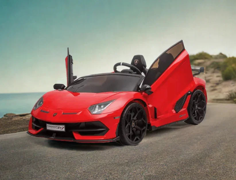Red Lamborghini Aventador toy car with open scissor doors on a coastal road