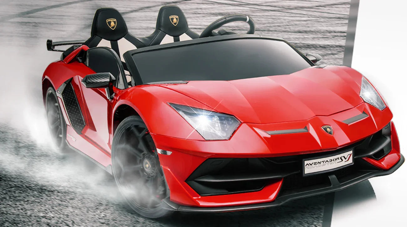 Red Lamborghini Aventador SVJ Roadster toy car drifting on a track, headlights on.
