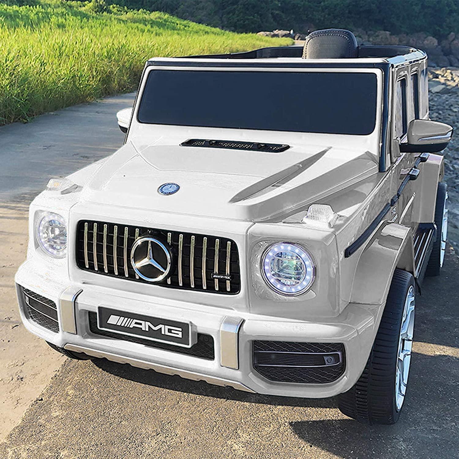 White Mercedes-Benz AMG G-Class kids electric ride-on car on an outdoor road