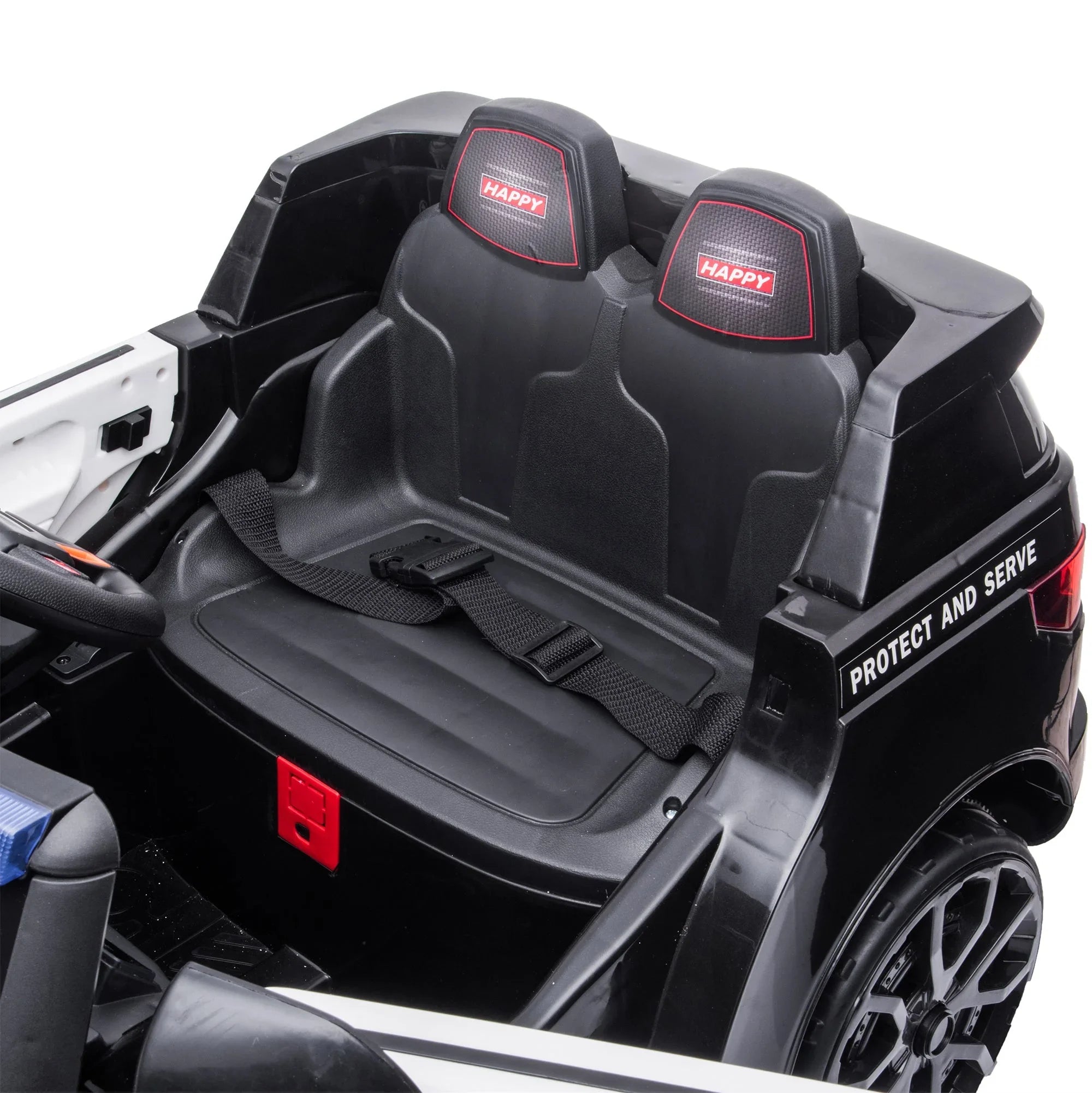 Black toy police car interior with two seats, seatbelt, and Protect and Serve text on side