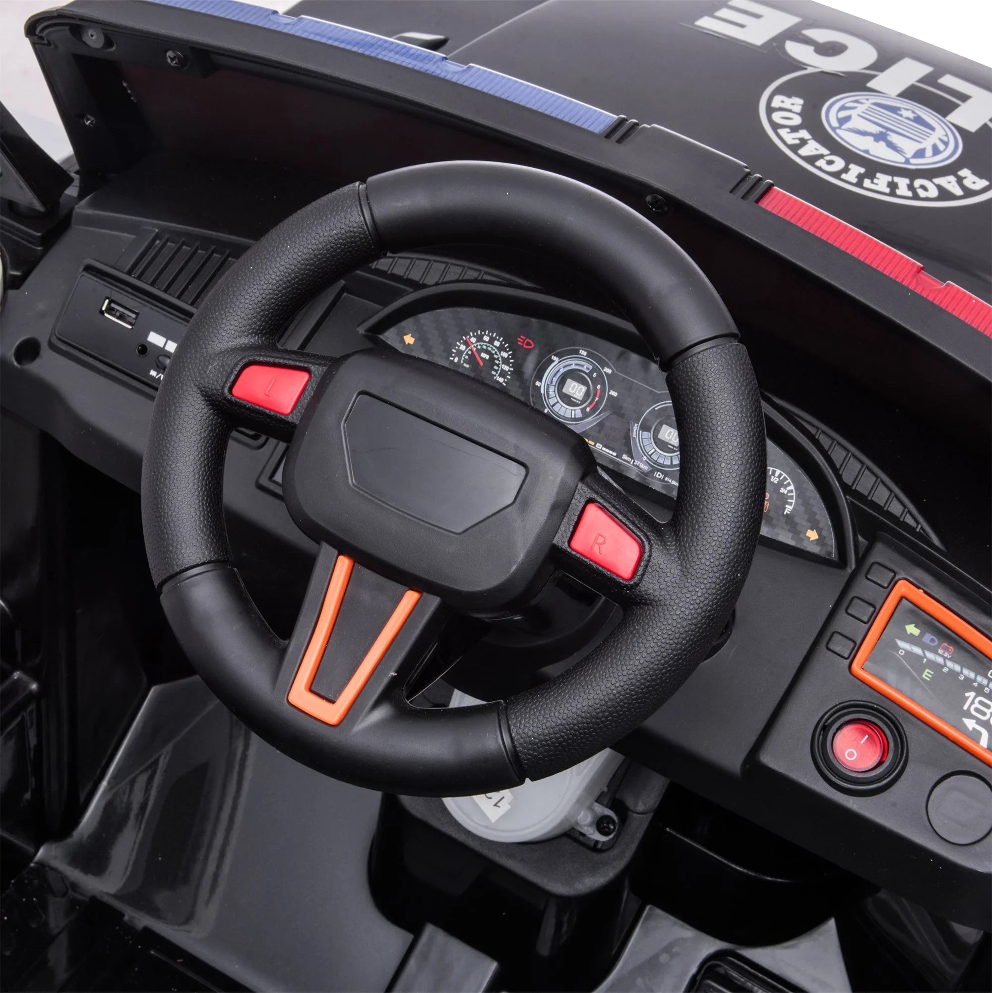 Close-up of toy police car dashboard and steering wheel with control buttons