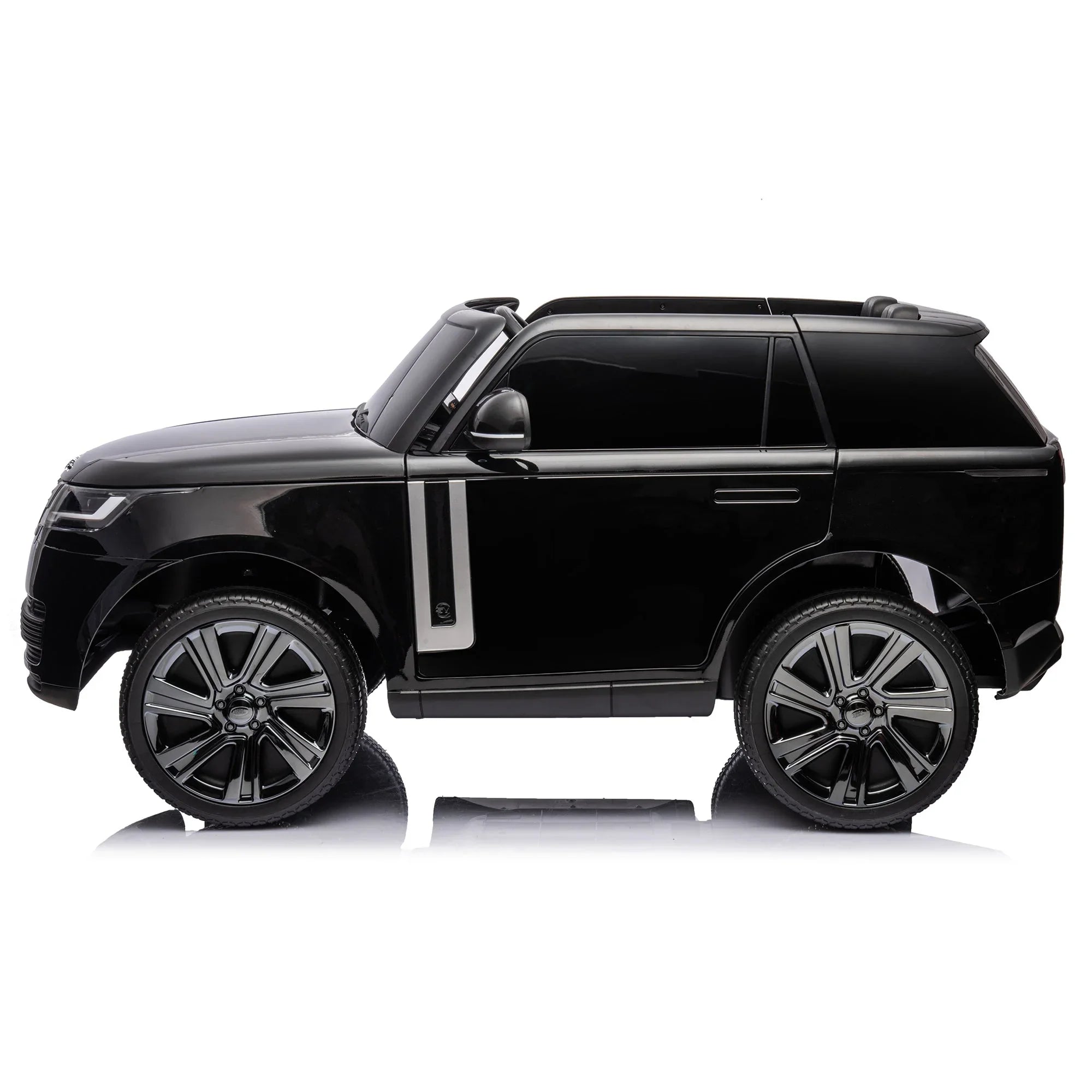 Black toy SUV car with silver trim and large wheels on white background