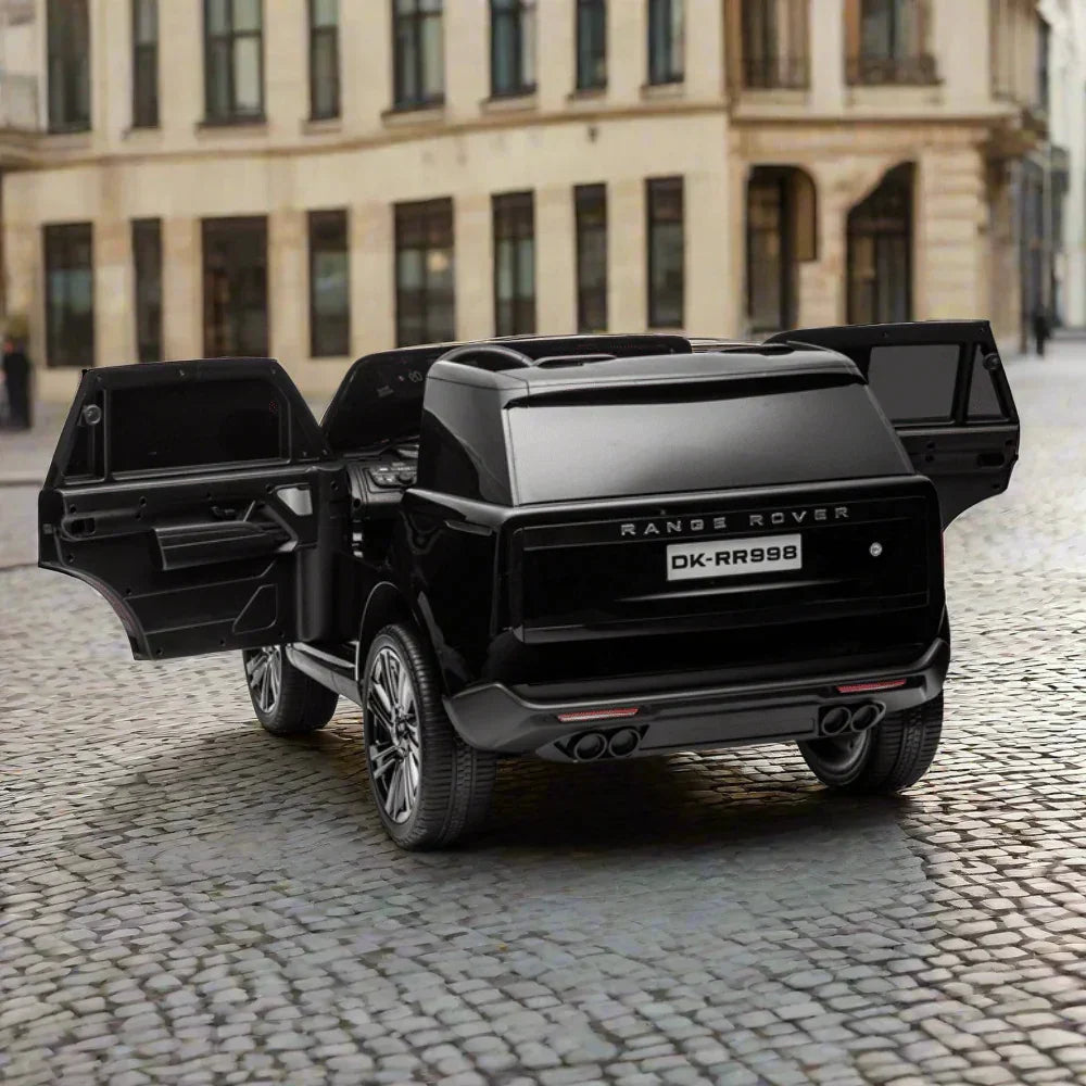 Black Range Rover toy car with open doors on cobblestone street, city background