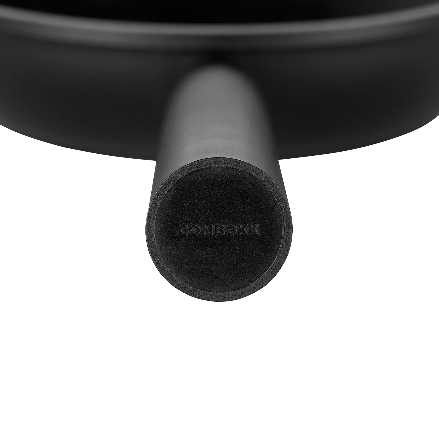 Close-up of black cast iron frying pan handle with COMBEKK logo, camping cookware
