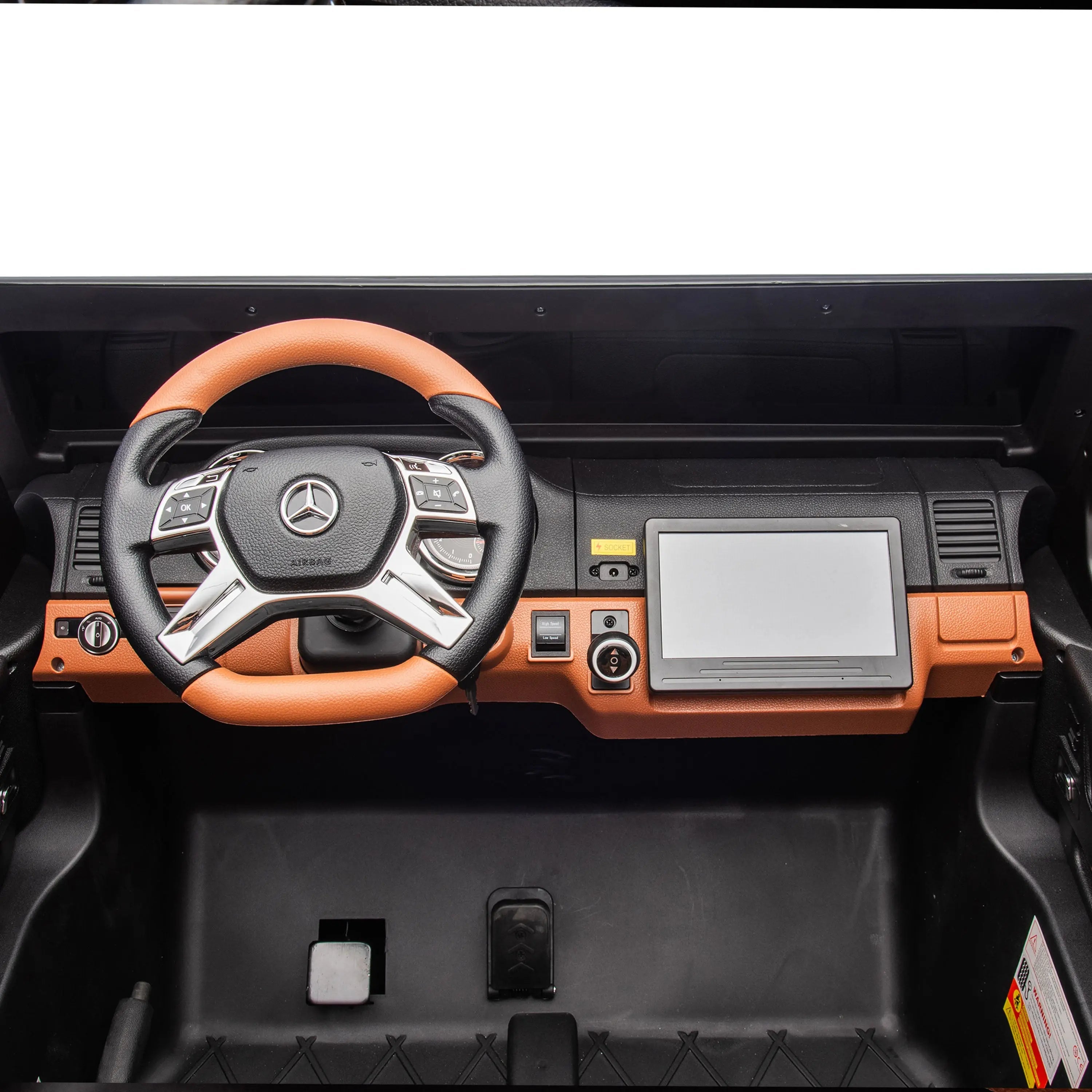 Close-up dashboard and steering wheel of kids' electric ride-on Mercedes G650 toy car