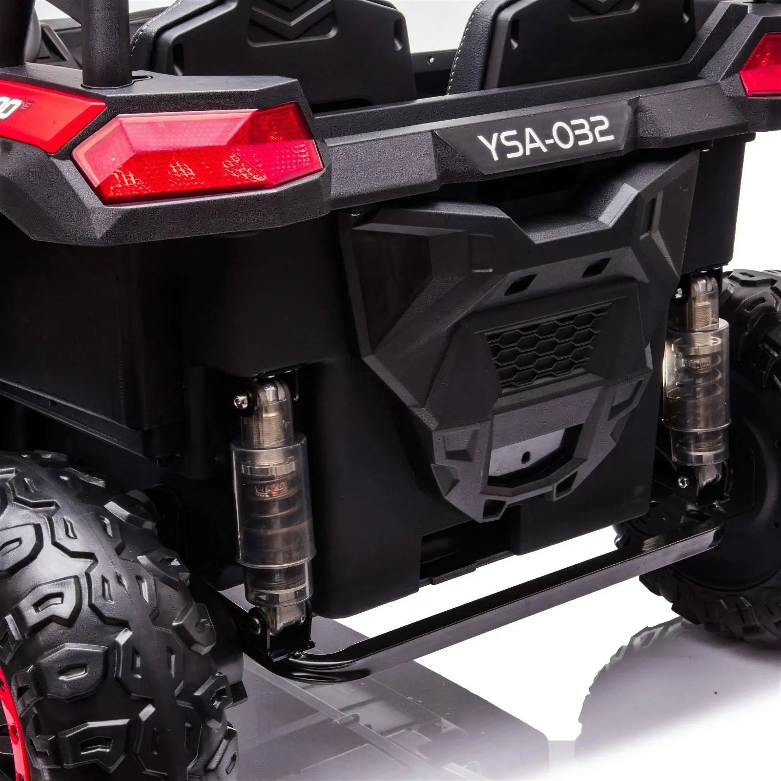 Rear view of a black kids' 2-seater ride-on 4x4 dune buggy with rugged tires and taillights