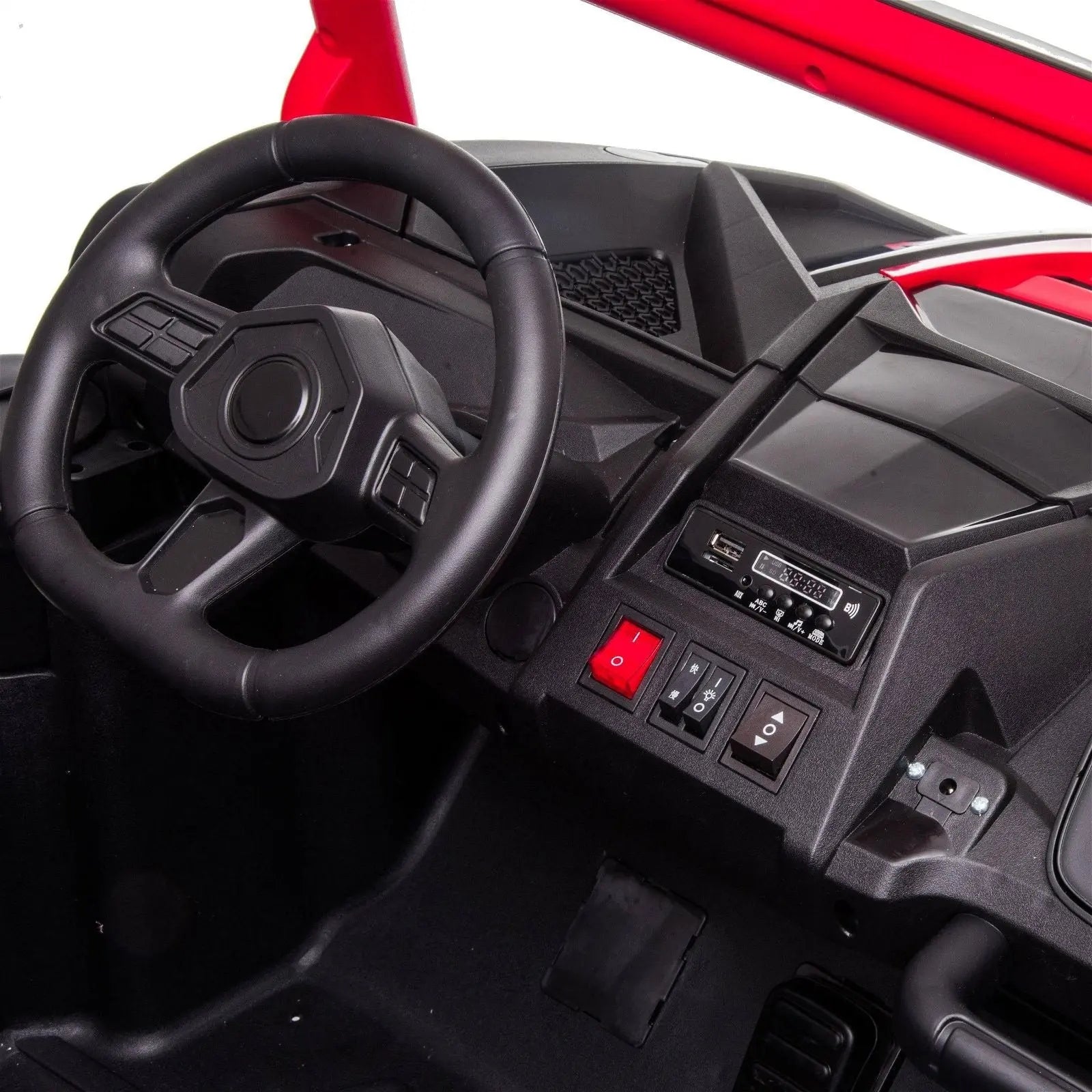 Close-up of kids ride-on 4x4 dune buggy dashboard with steering wheel and control buttons