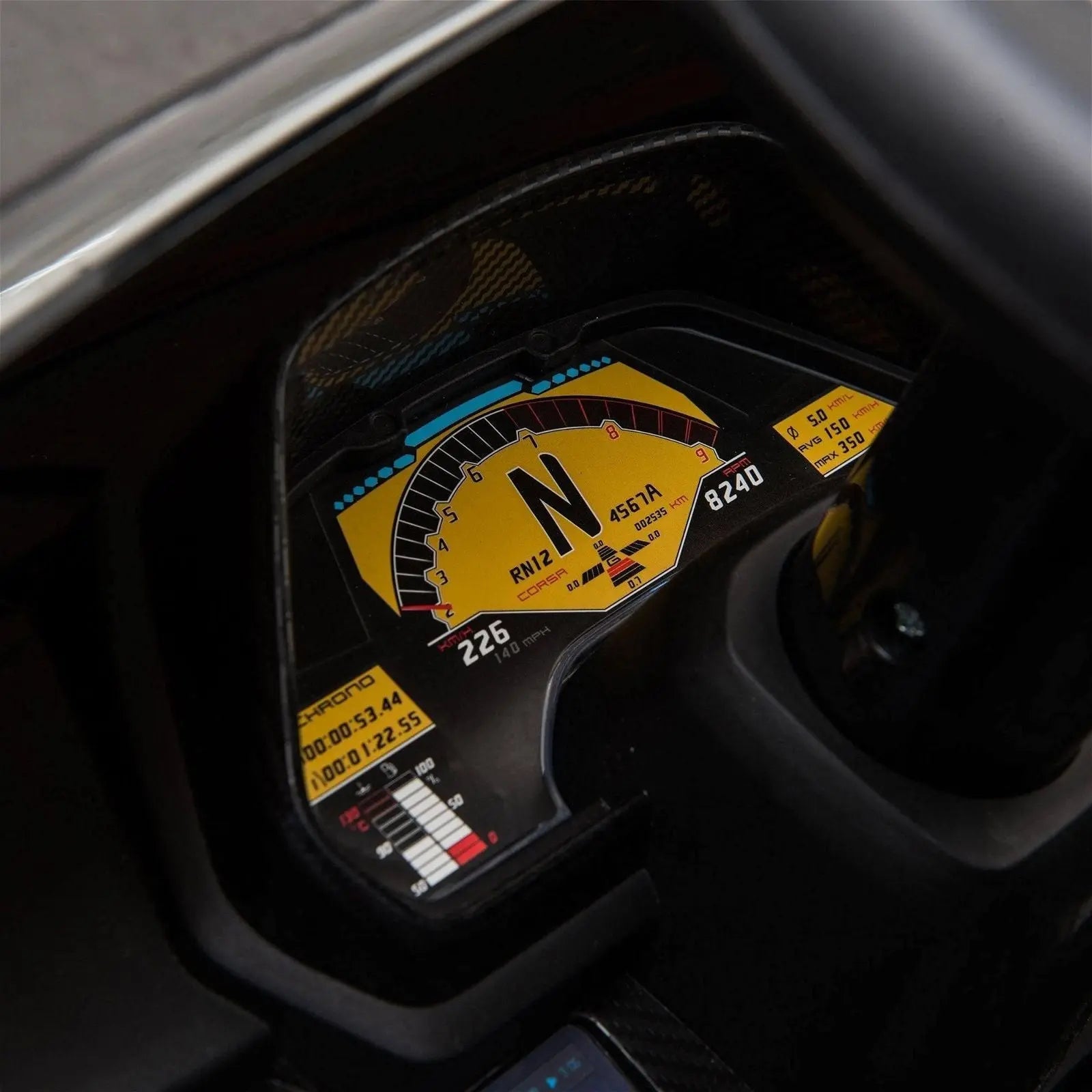Close-up of Lamborghini Veneno ride-on car dashboard with digital speedometer and controls.