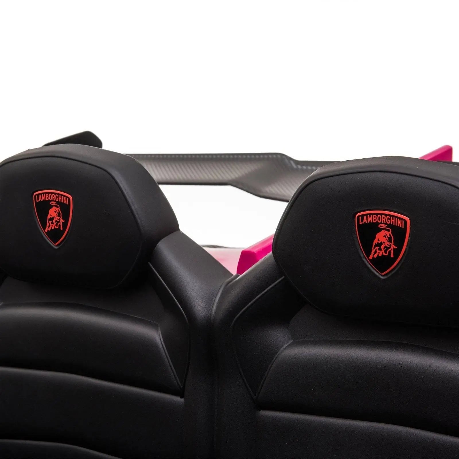 Close-up of two black leather seats with Lamborghini logo in a kids ride-on car
