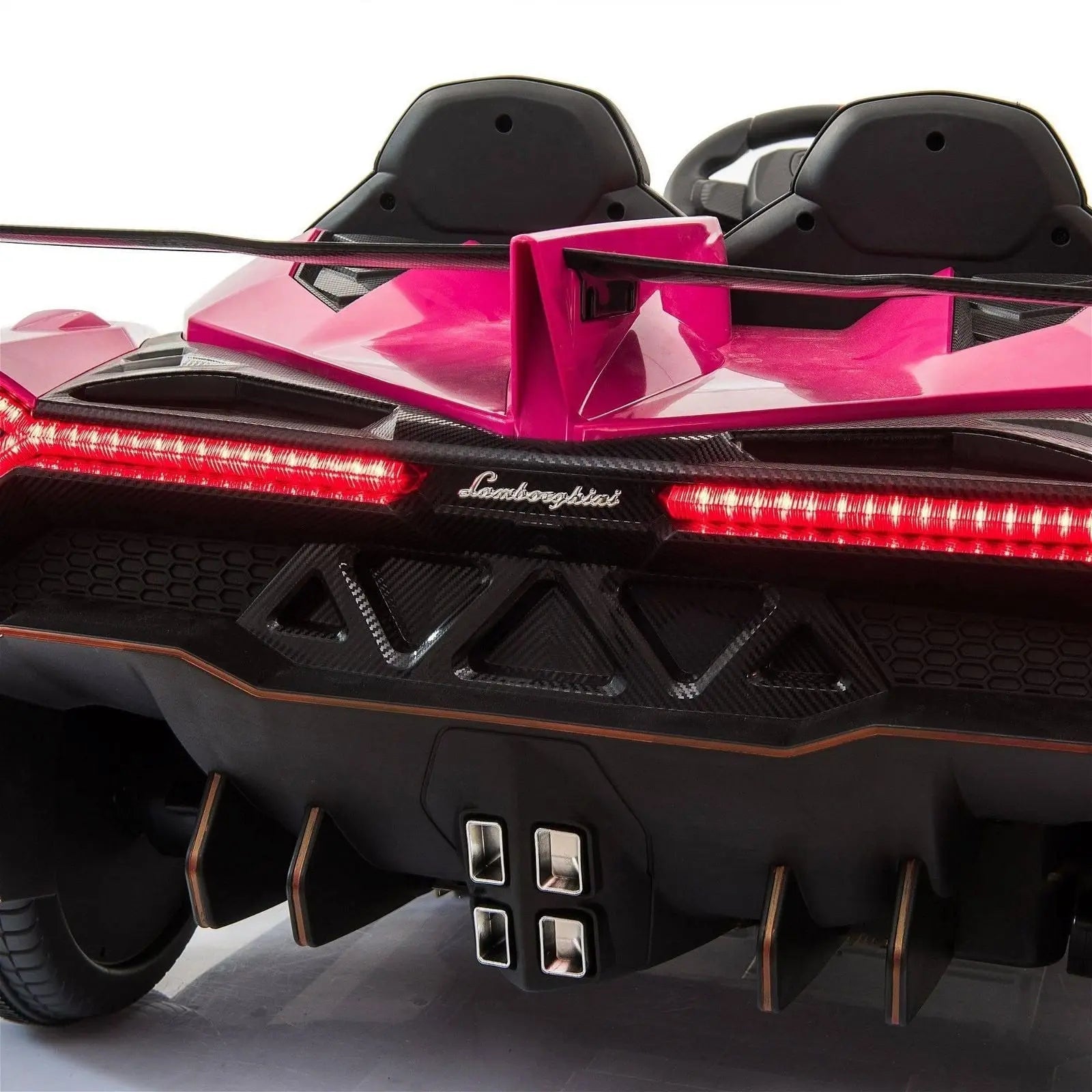 Rear view of pink two-seater Lamborghini Veneno ride-on car for kids with LED lights