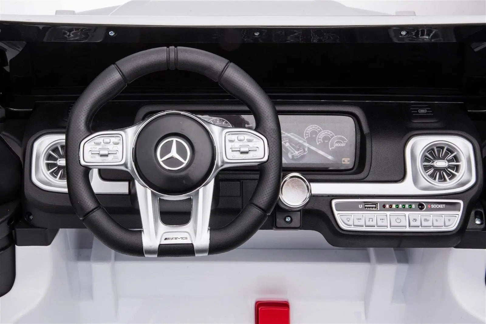 Close-up of toy Mercedes-Benz G63 AMG ride-on car dashboard and steering wheel