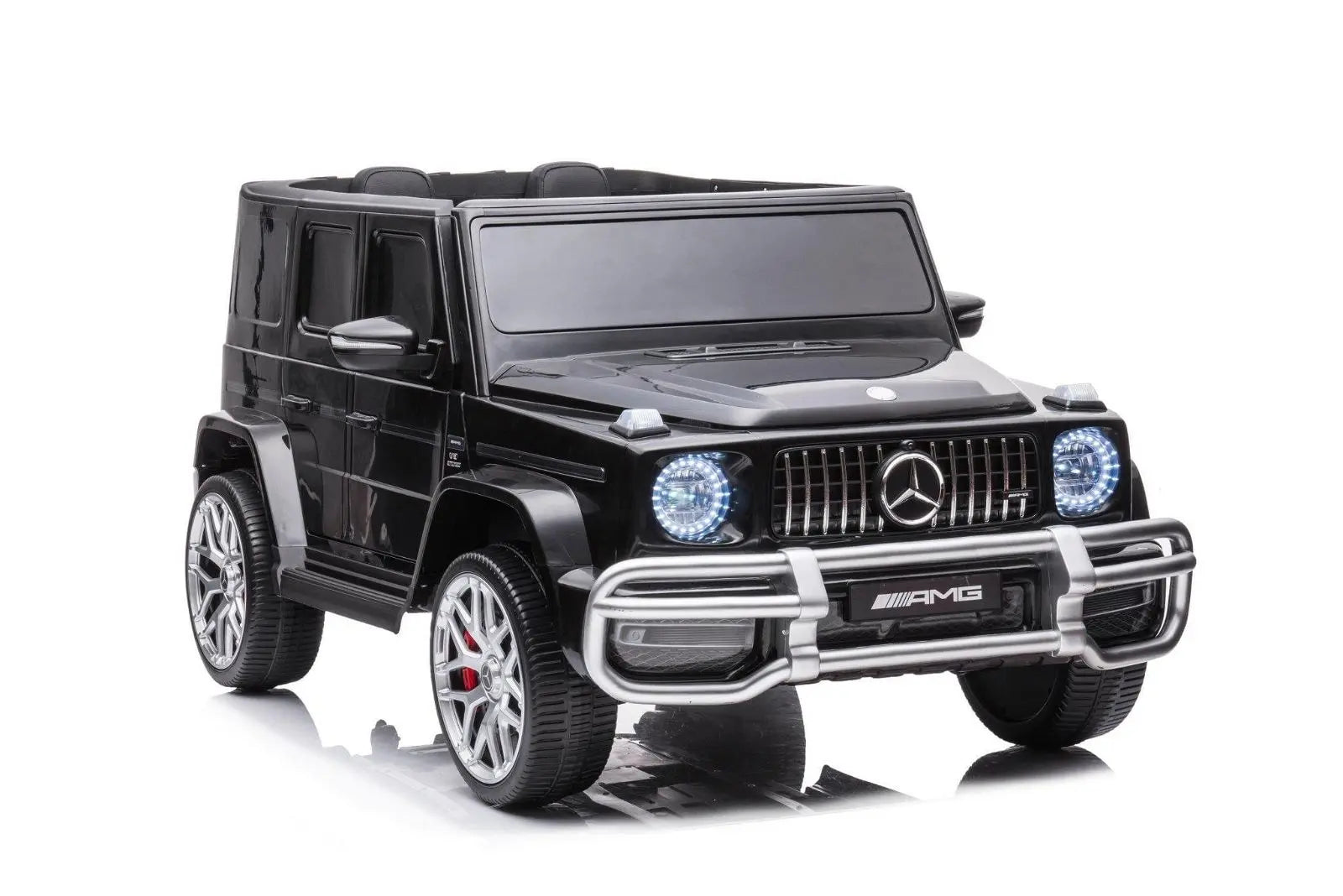 Black Mercedes G63 AMG kids ride on car toy with LED headlights, silver trim, and realistic detailing