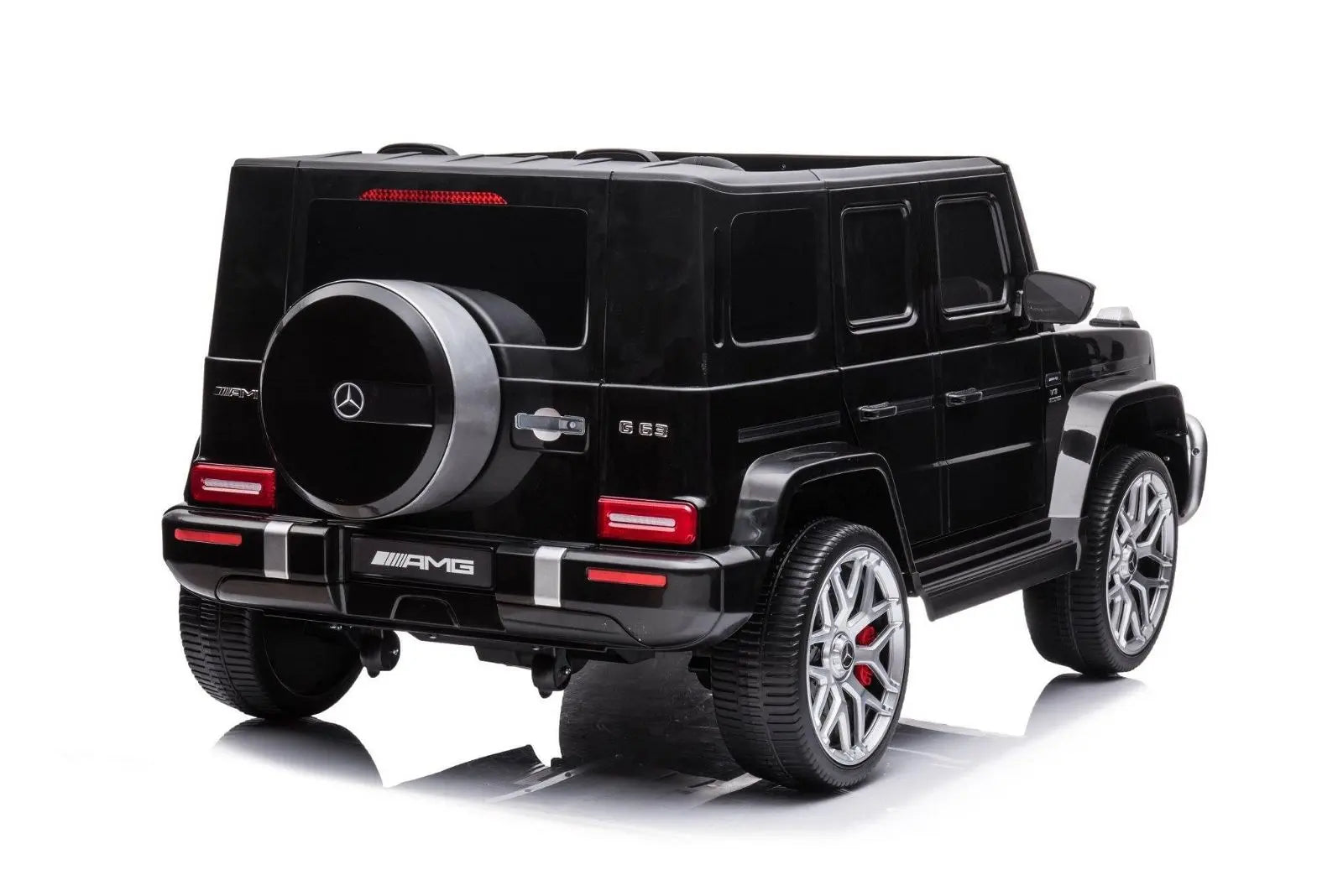 Black 2-seater Mercedes G63 AMG kids ride-on car, rear view, with detailed wheels