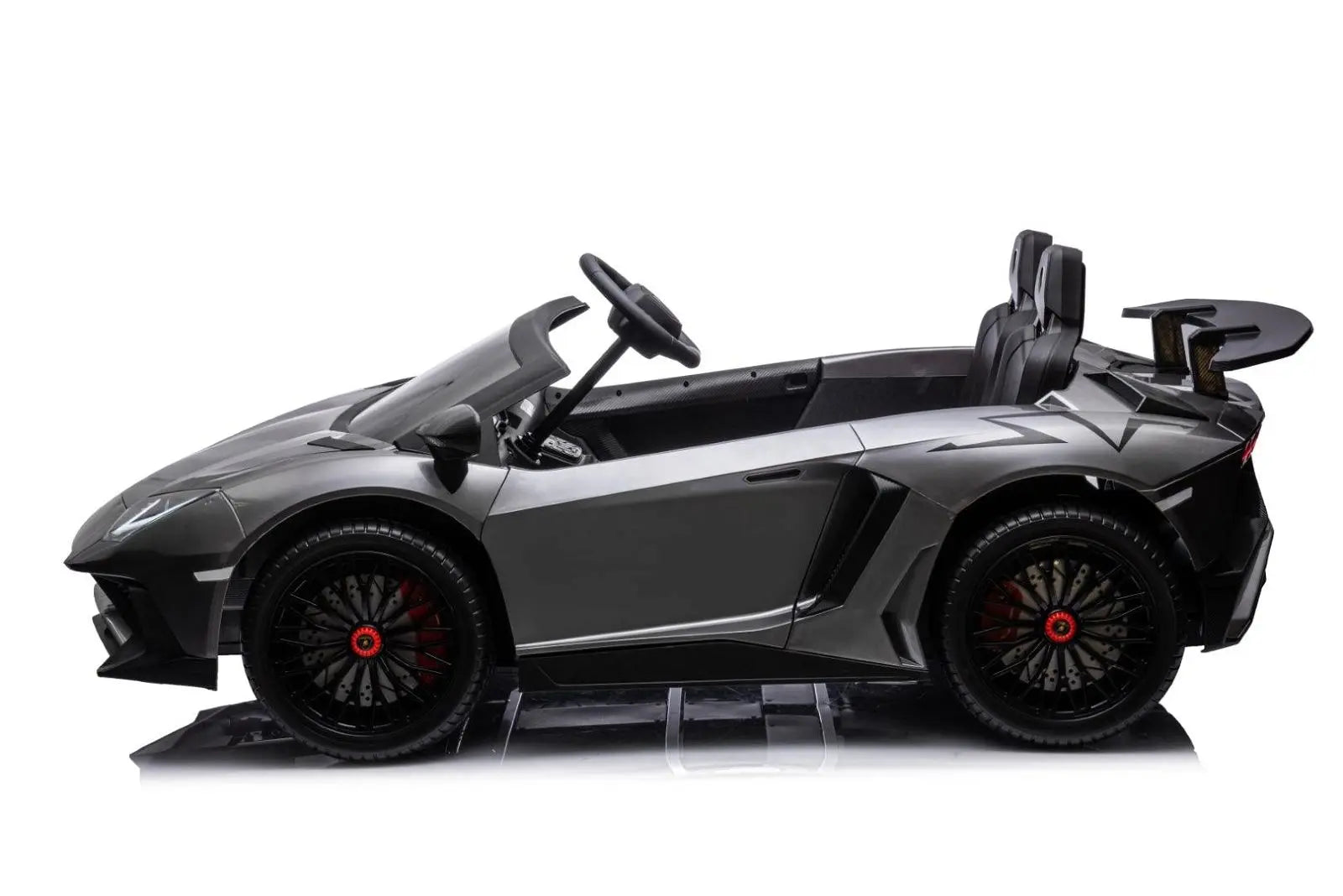 Black two-seater ride on toy sports car for kids with realistic details and spoiler