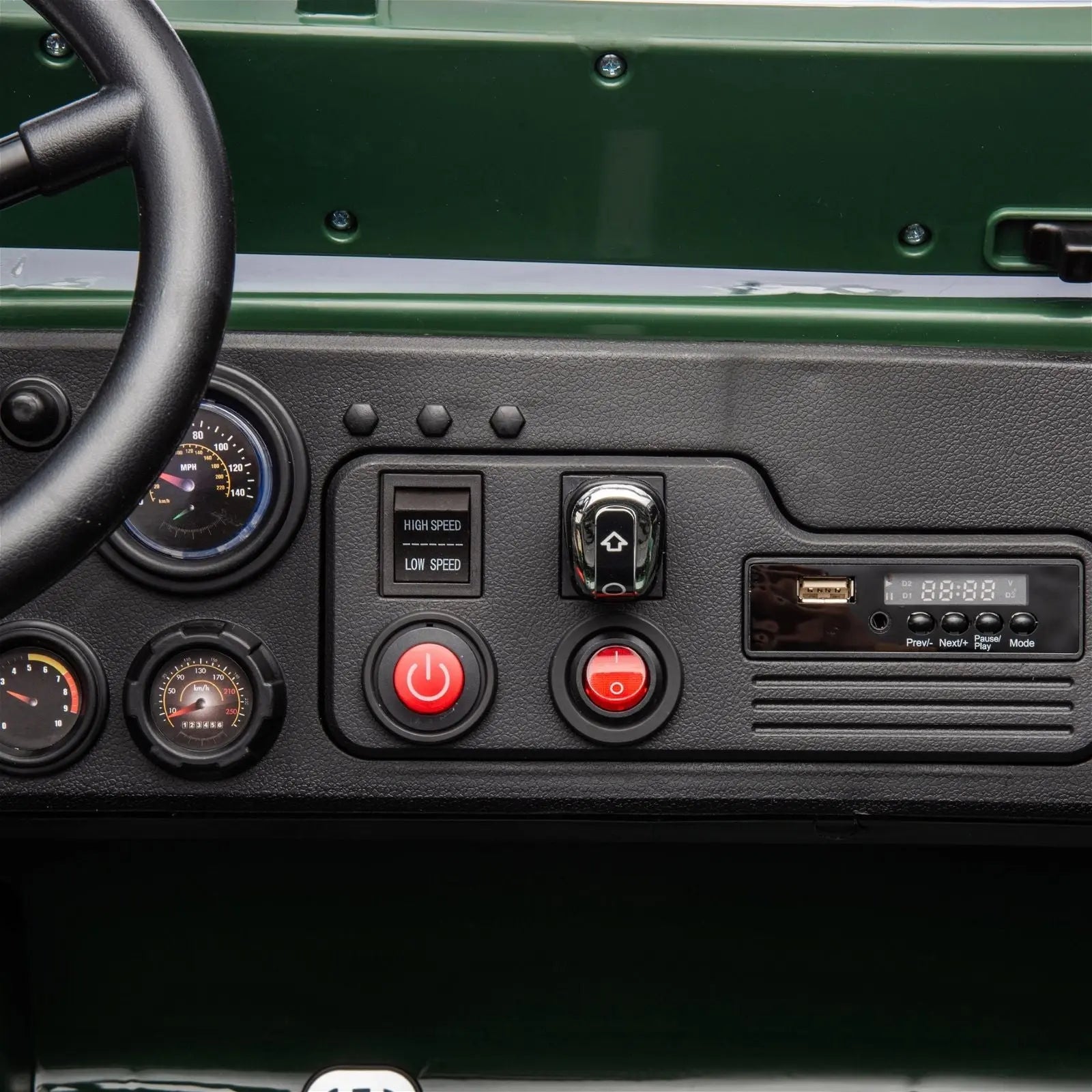 Close-up dashboard of electric ride-on military jeep with speed controls and steering wheel.