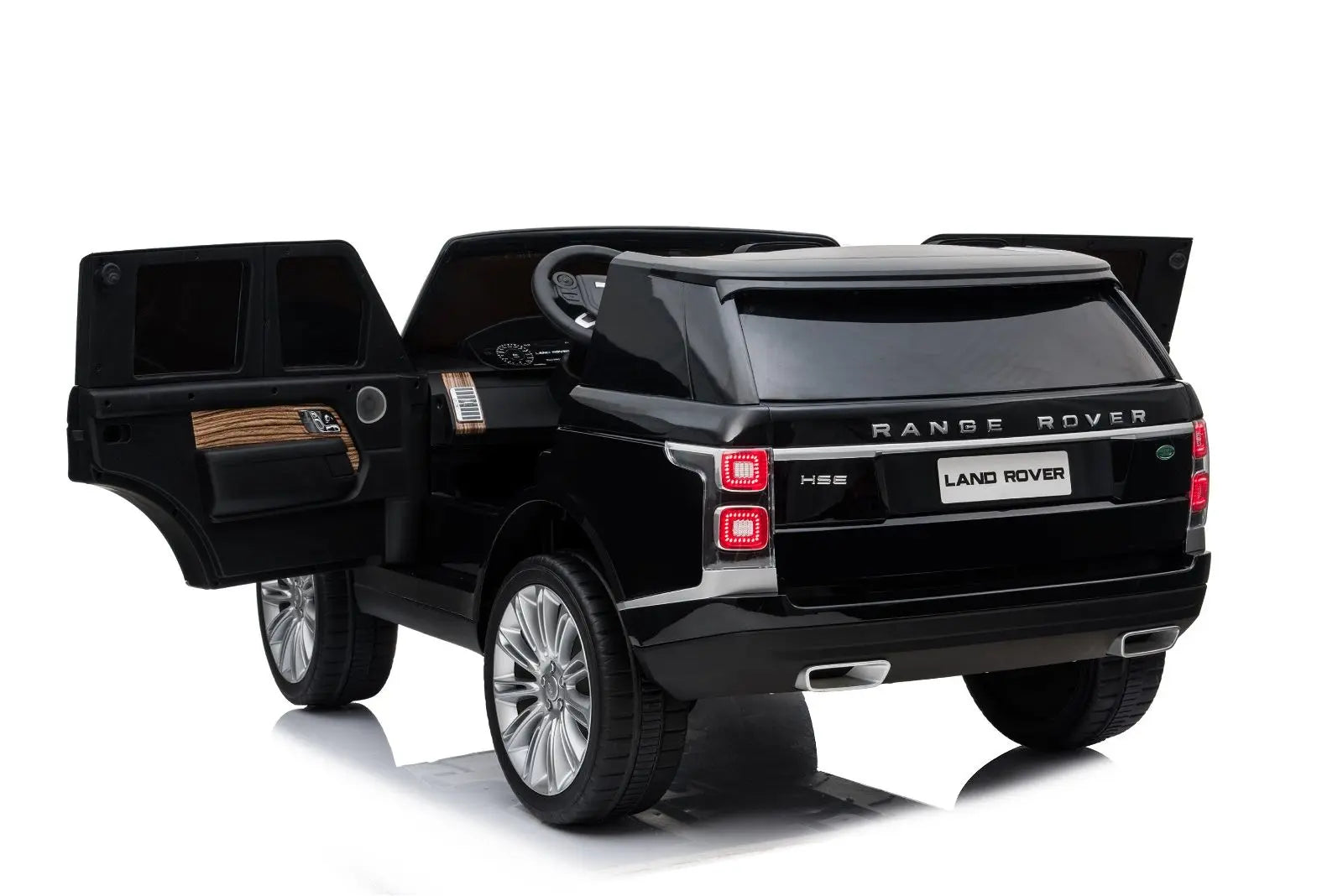 Black 2-seater Range Rover HSE ride-on toy car with open doors, detailed interior
