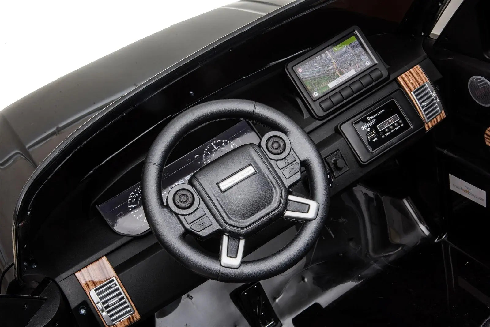 Detailed dashboard and steering wheel of a 24V Range Rover HSE kids ride-on car