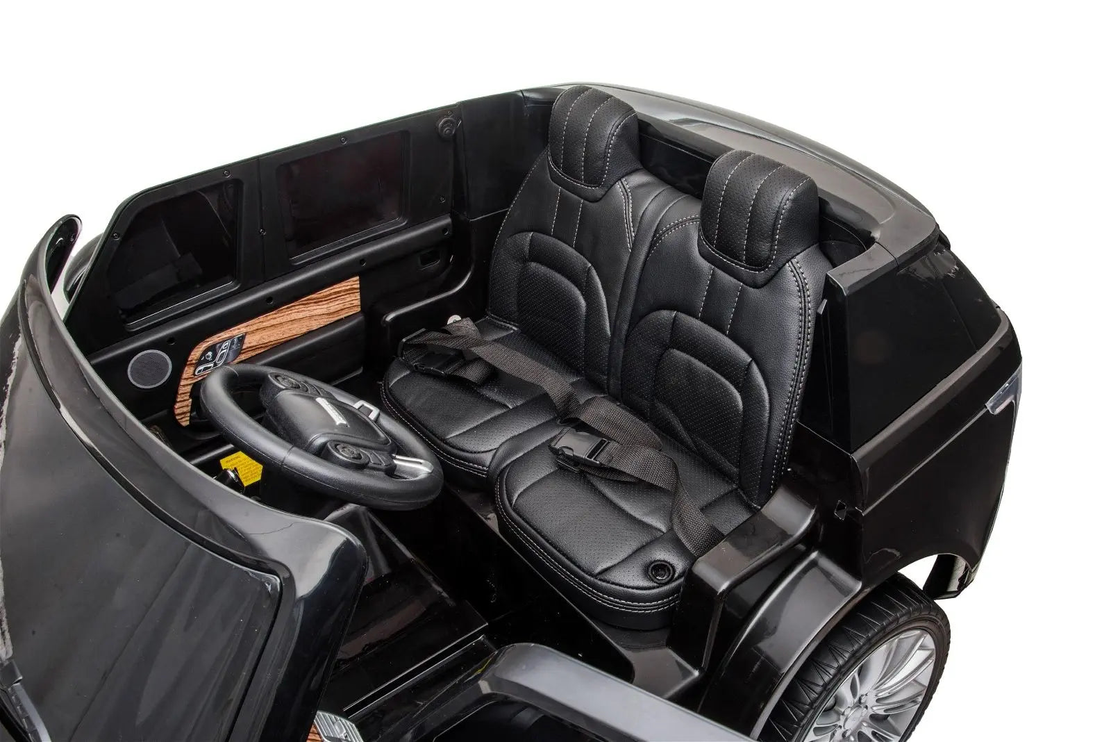 24V black toy Range Rover HSE ride-on, two leather seats, seat belts, steering wheel visible