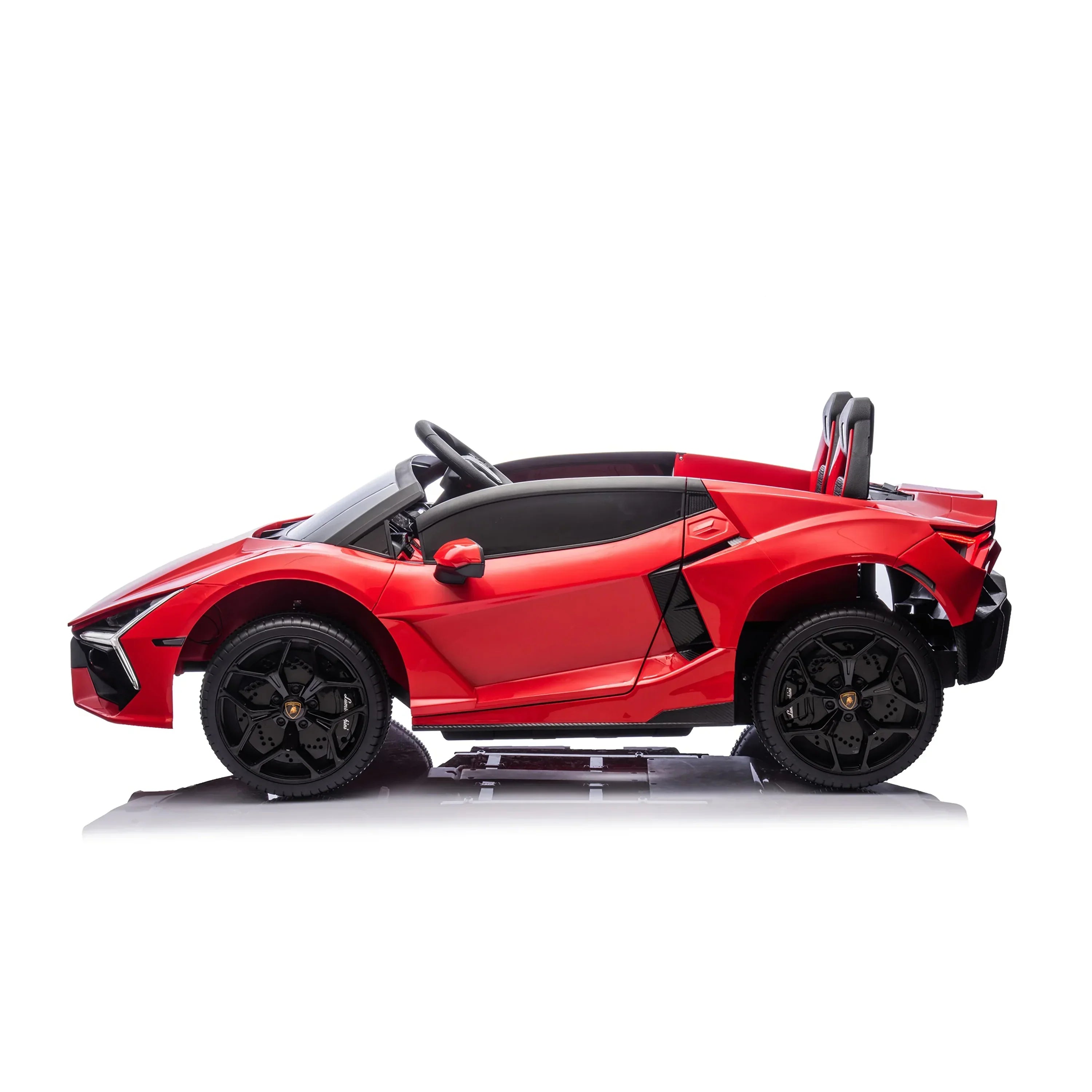 Red kids electric ride-on sports car with black wheels and open seats on white background