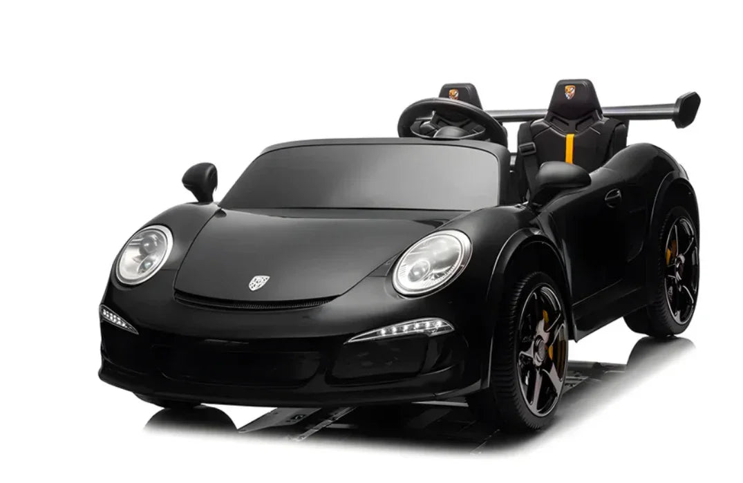 Black kids ride-on electric sports car with yellow accents and spoiler