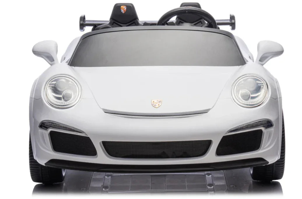 White Porsche-style kids ride-on car front view, sleek headlights, black windshield
