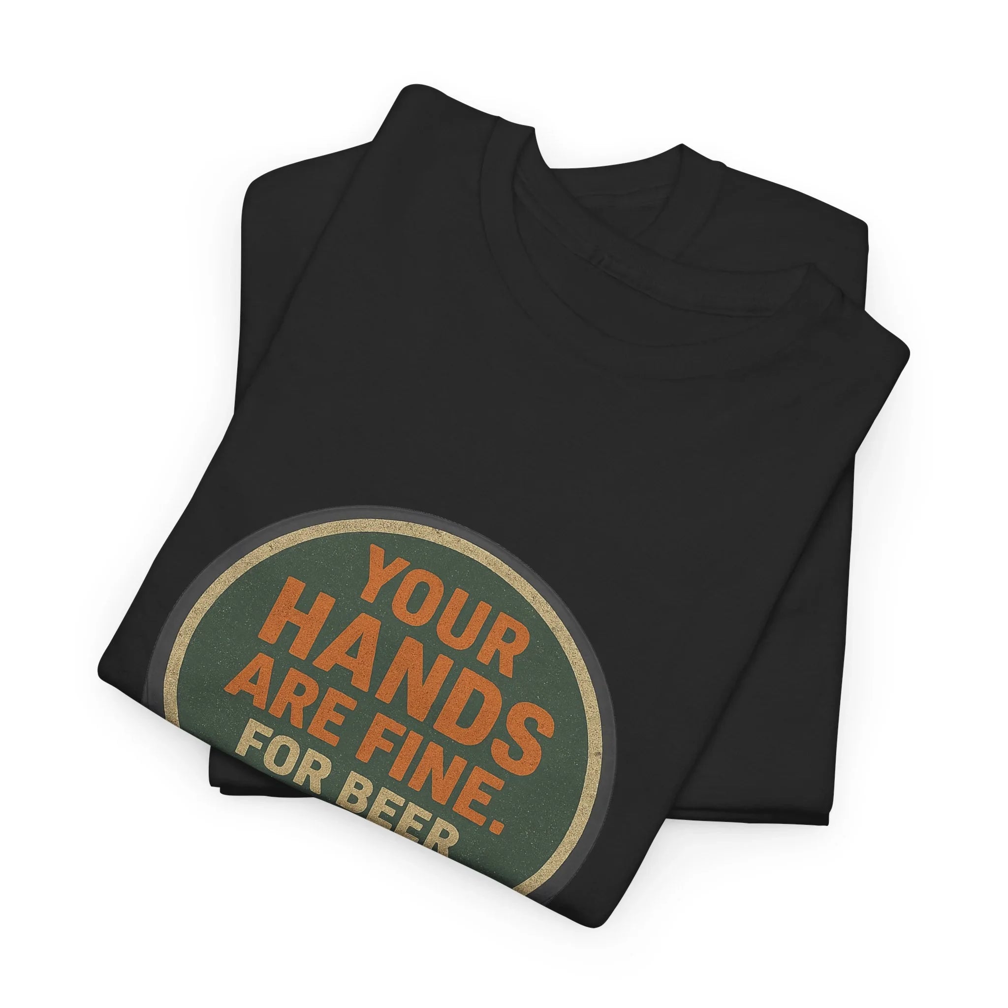 Folded black t-shirt with vintage-style text graphic saying 'Your hands are fine. For beer.'