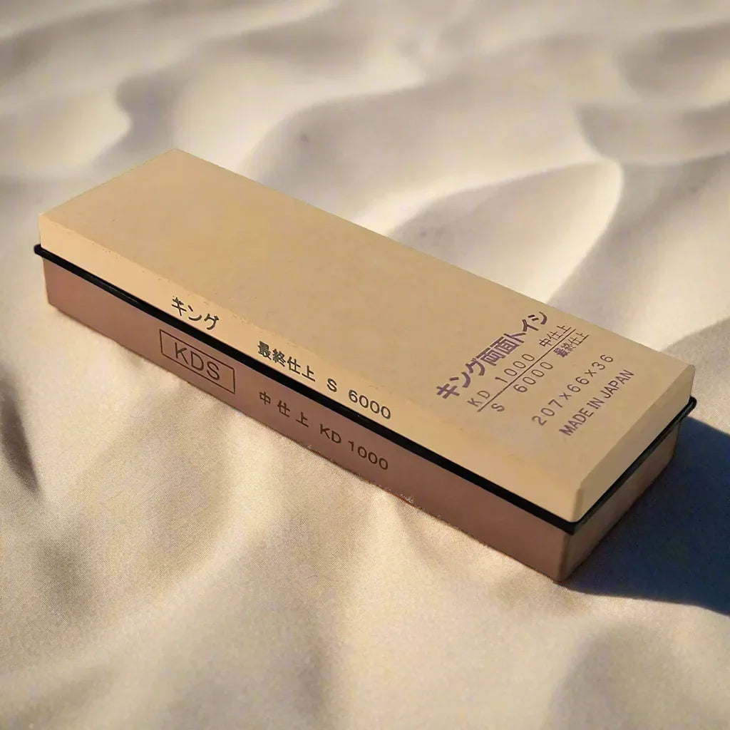 Japanese King KDS 1000/6000 grit sharpening stone on a soft fabric surface