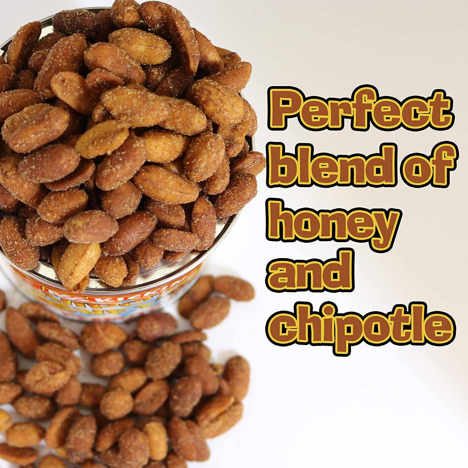Roasted honey chipotle peanuts in a tin and scattered on a white surface, snack text overlay.