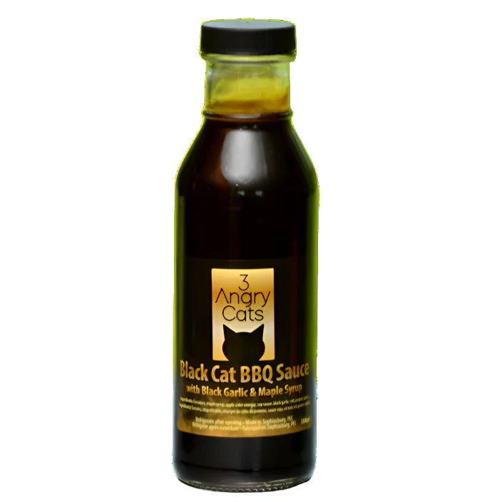 Bottle of 3 Angry Cats Black Cat BBQ Sauce with black garlic and maple syrup label
