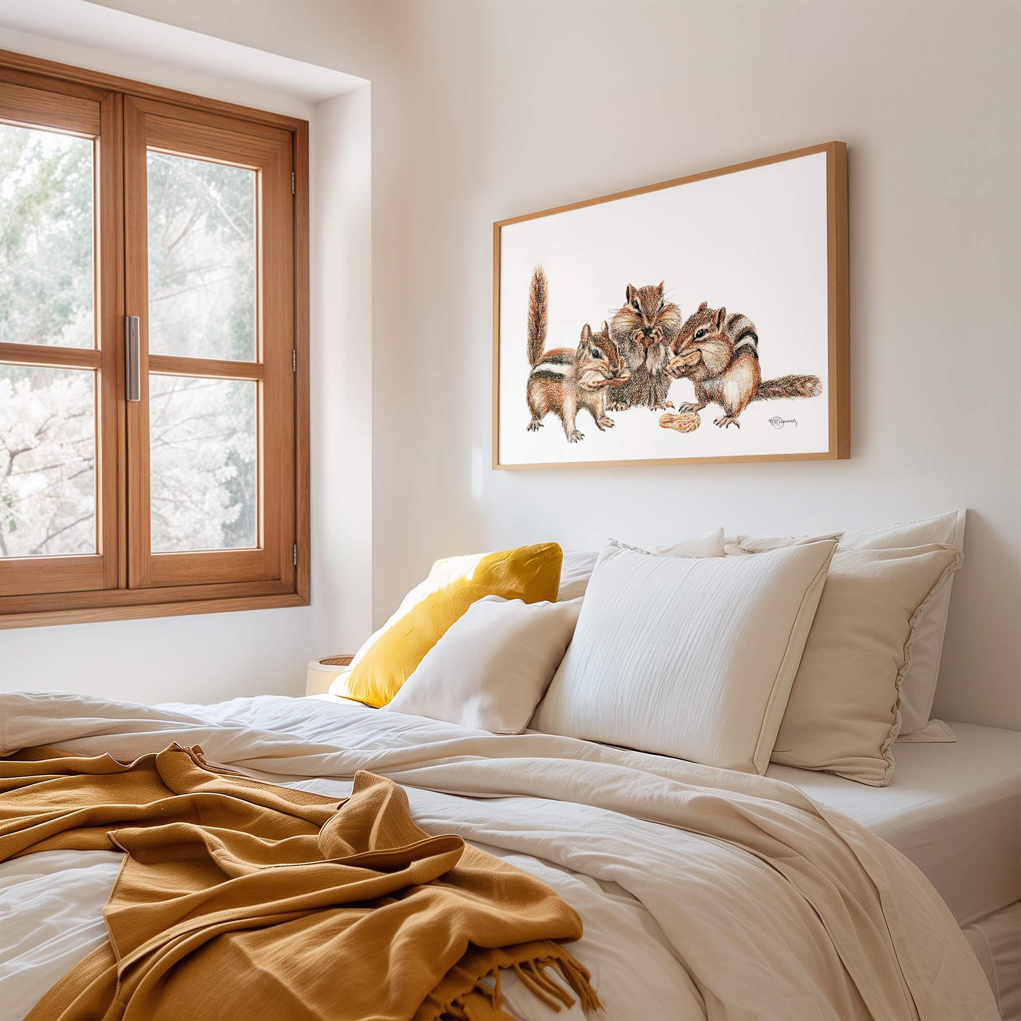 Cozy bedroom with yellow accents and framed three chipmunks illustration on the wall.