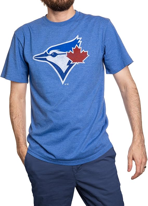Man wearing blue graphic t-shirt with bird and red maple leaf logo, casual outdoor apparel