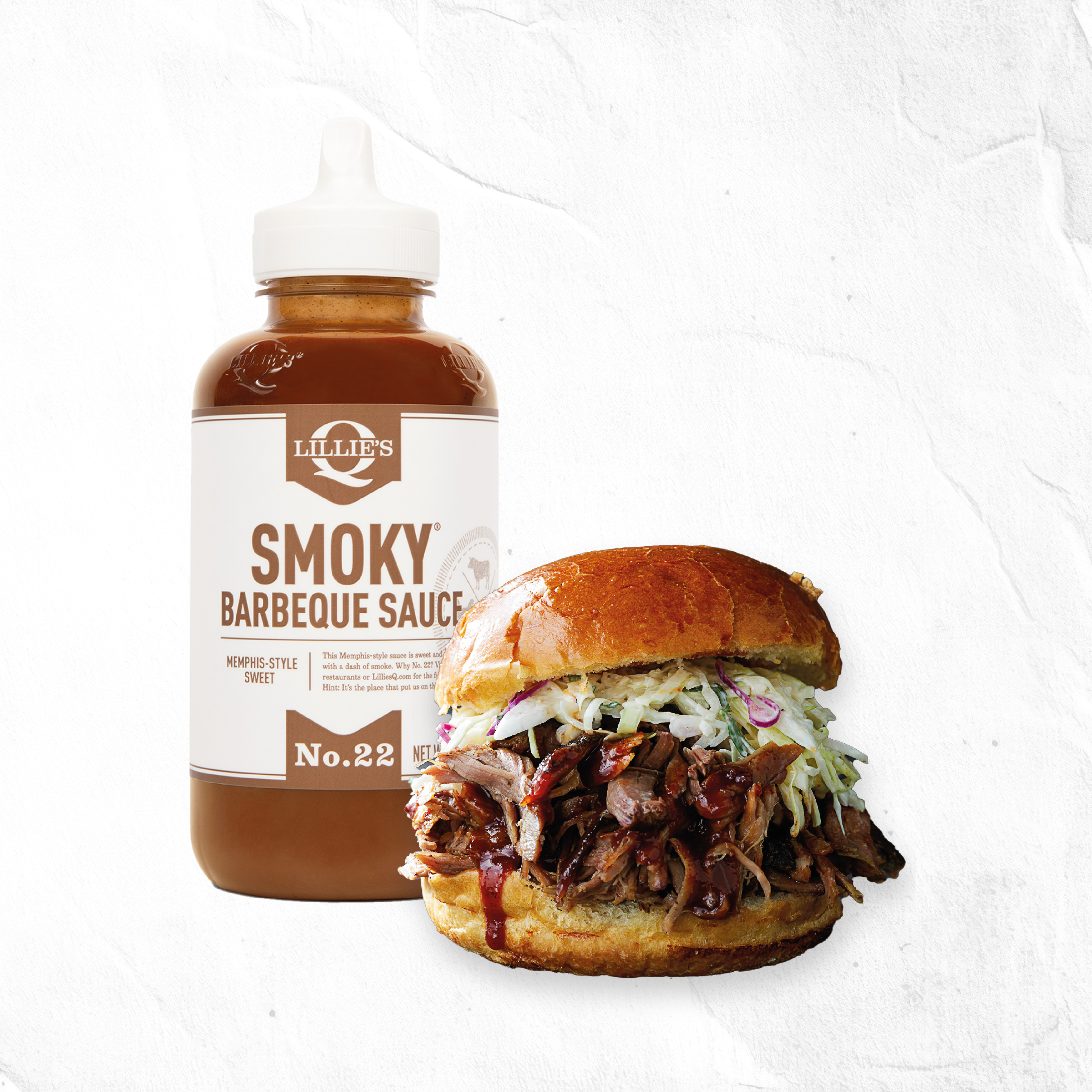 Pulled pork sandwich with coleslaw and bottle of Lillie's smoky barbeque sauce
