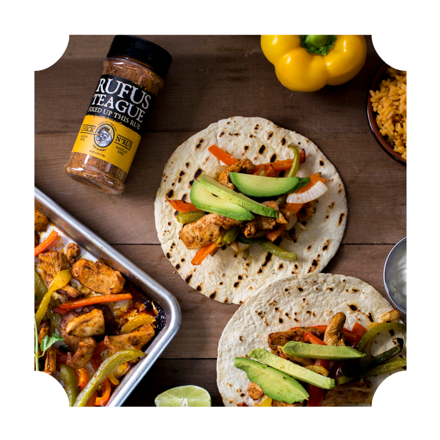 Grilled chicken fajitas on tortillas with avocado, peppers, and seasoning, outdoor cooking theme.