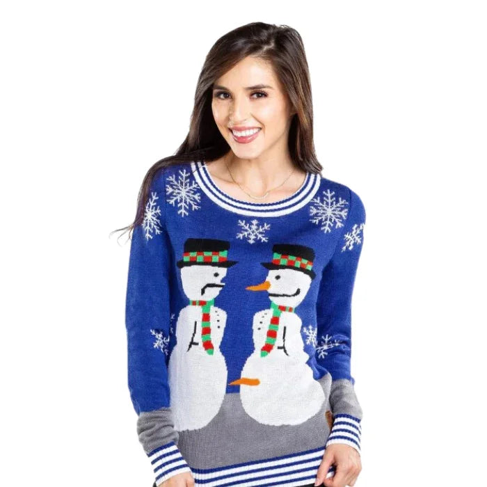 Woman wearing blue Christmas sweater with snowmen and snowflake design
