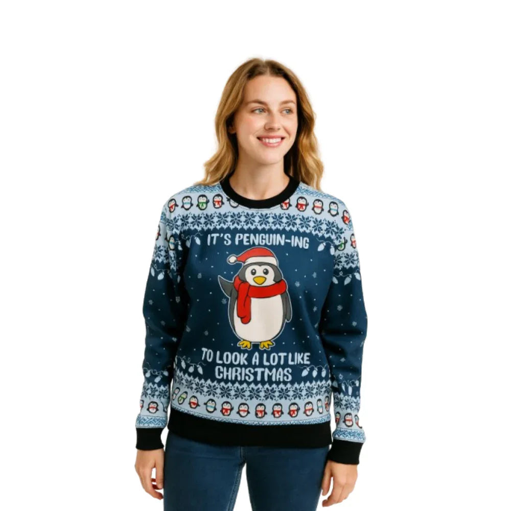 Woman wearing blue Christmas sweater with cartoon penguin, snowflakes, and festive text