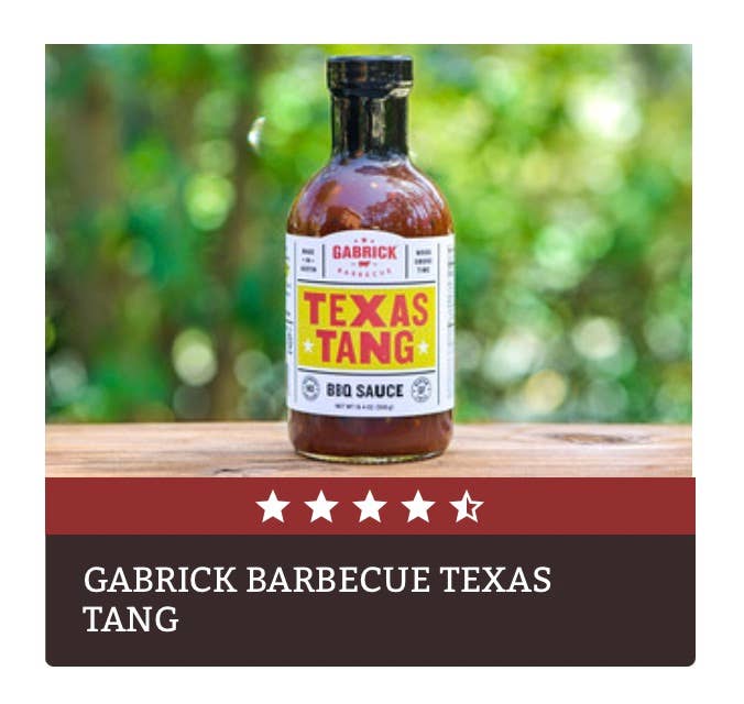 Gabrick Texas Tang BBQ sauce bottle on wooden table outdoors, barbecue seasoning product