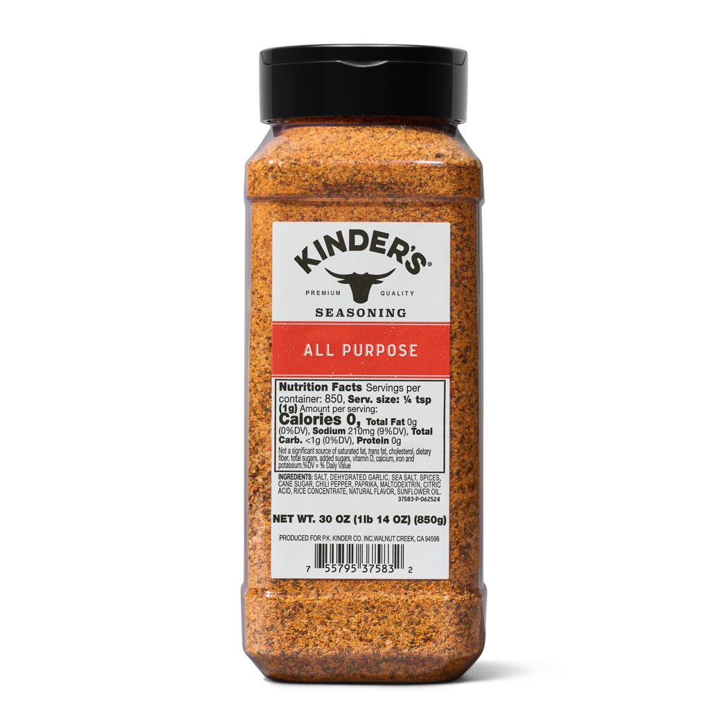 All purpose seasoning spice blend in clear plastic container with black lid
