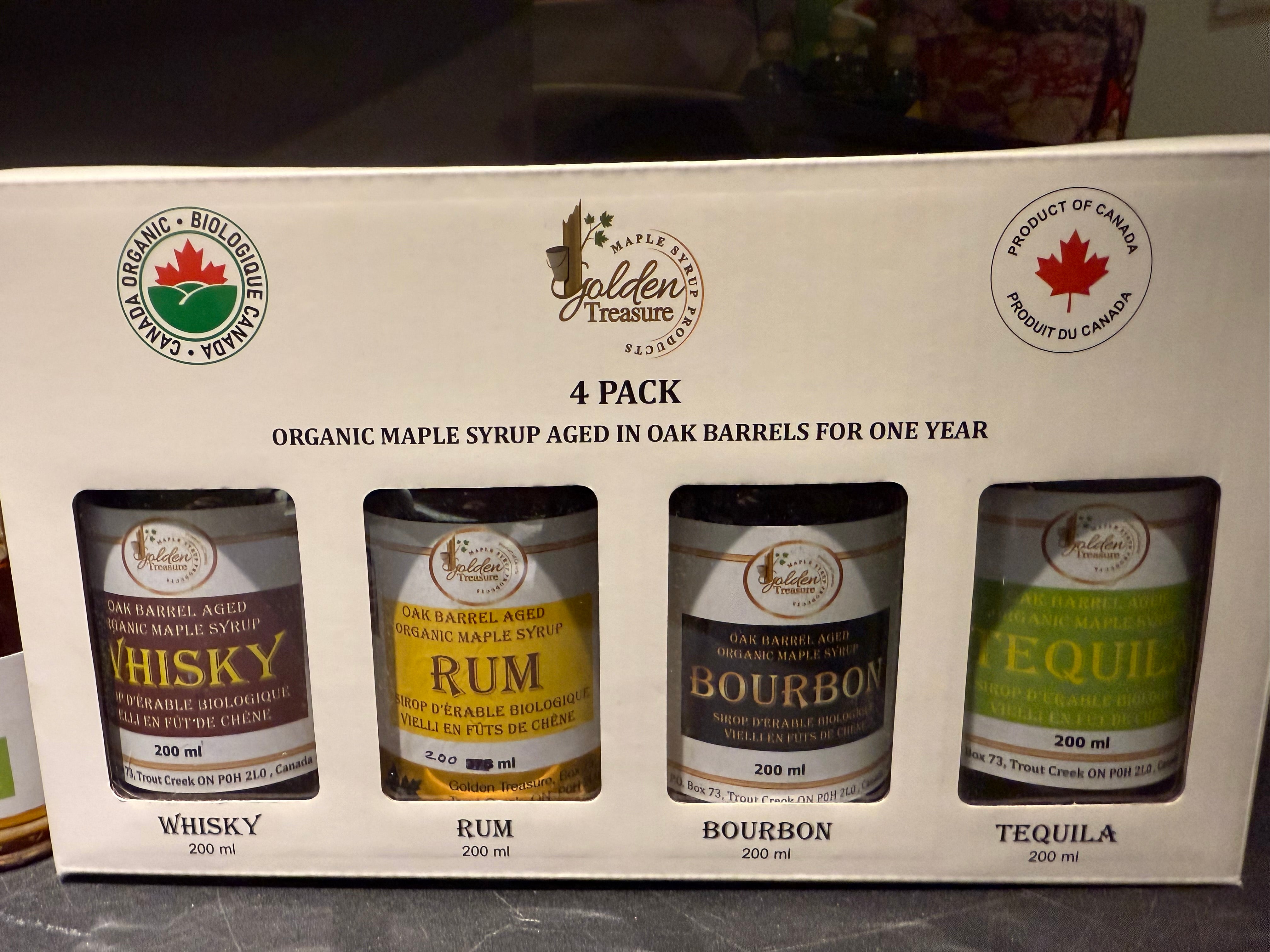 4 pack of organic maple syrup bottles aged in oak barrels with whisky, rum, bourbon, and tequila flavors
