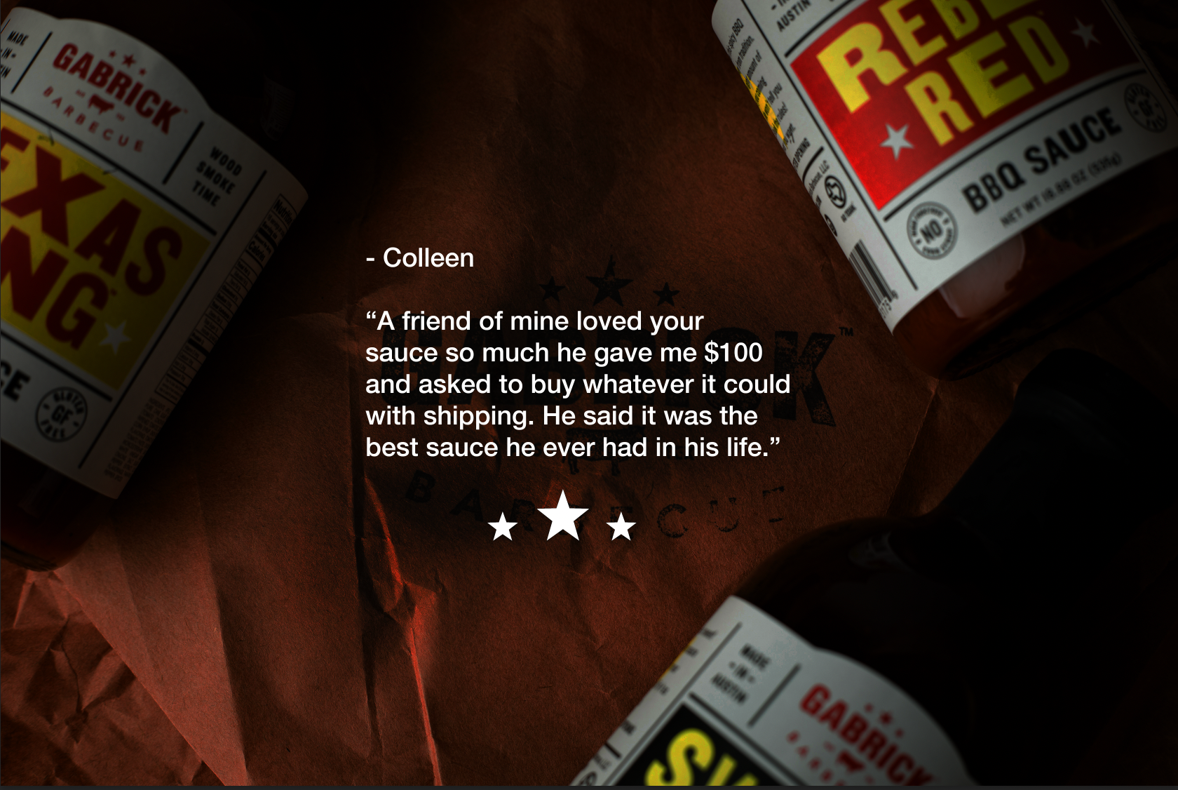 Closeup of Gabrick Barbecue Texas Tang and Rebel Red BBQ sauce bottles with customer testimonial text on brown paper.
