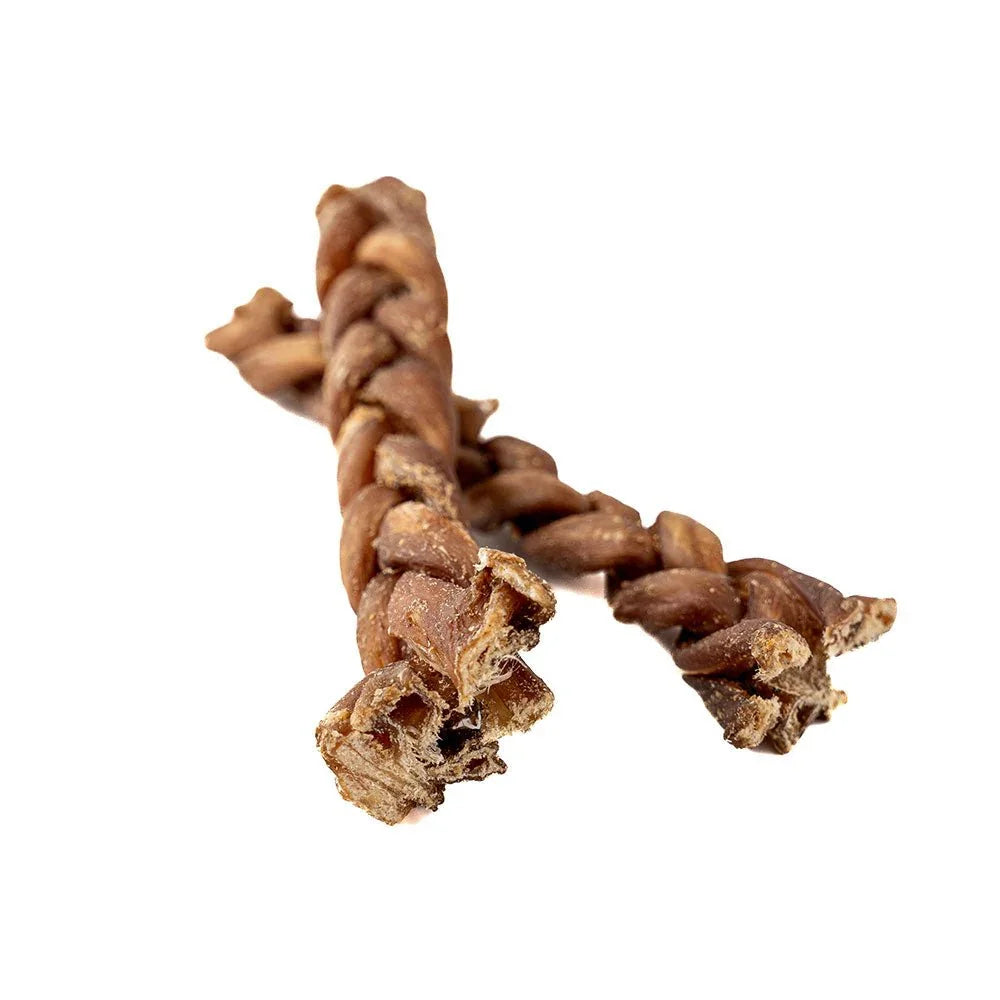 Braided lamb gullet dog chews on white background, natural pet treats