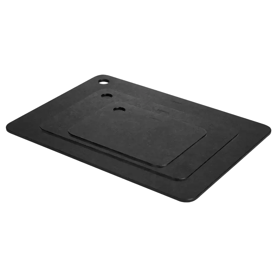 Set of three black camping cutting boards stacked on white background