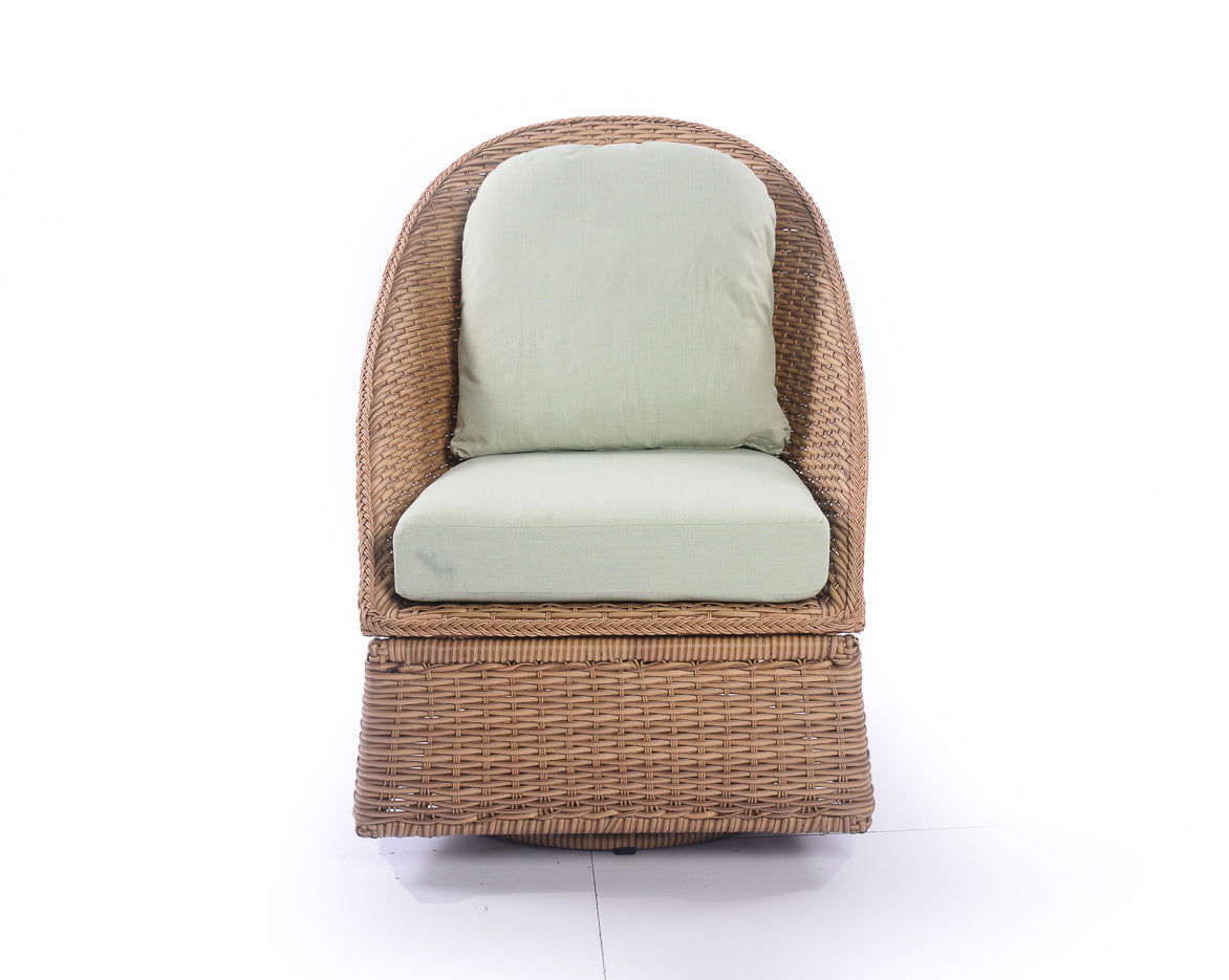 Outdoor wicker armchair with light green cushions on white background