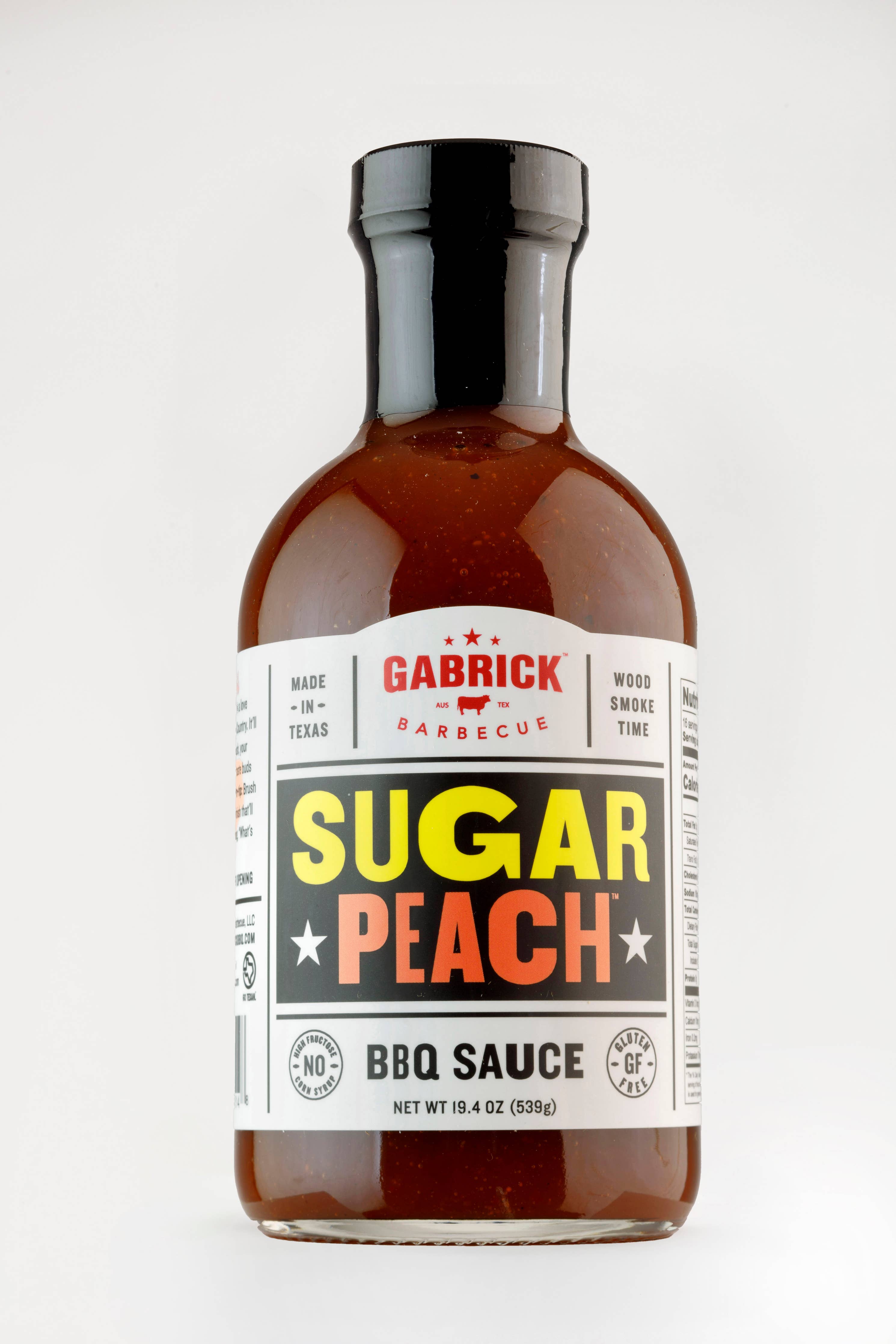 Bottle of Gabrick Barbecue Sugar Peach BBQ sauce against white background