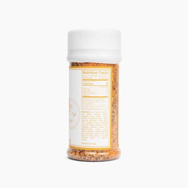 Seasoning spice blend bottle with visible nutrition label for camping or outdoor cooking