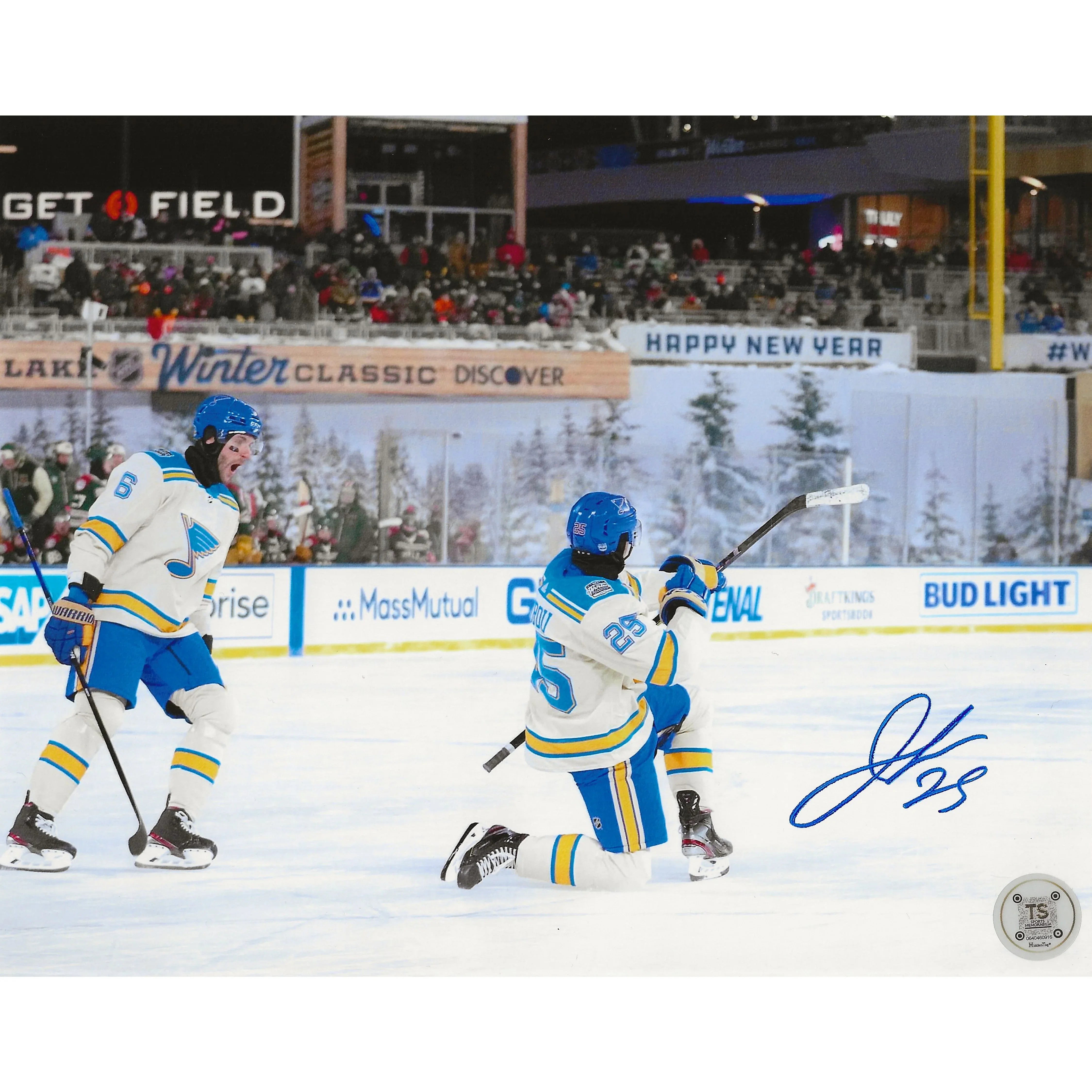 Outdoor hockey players in white and blue jerseys celebrating on ice during Winter Classic game