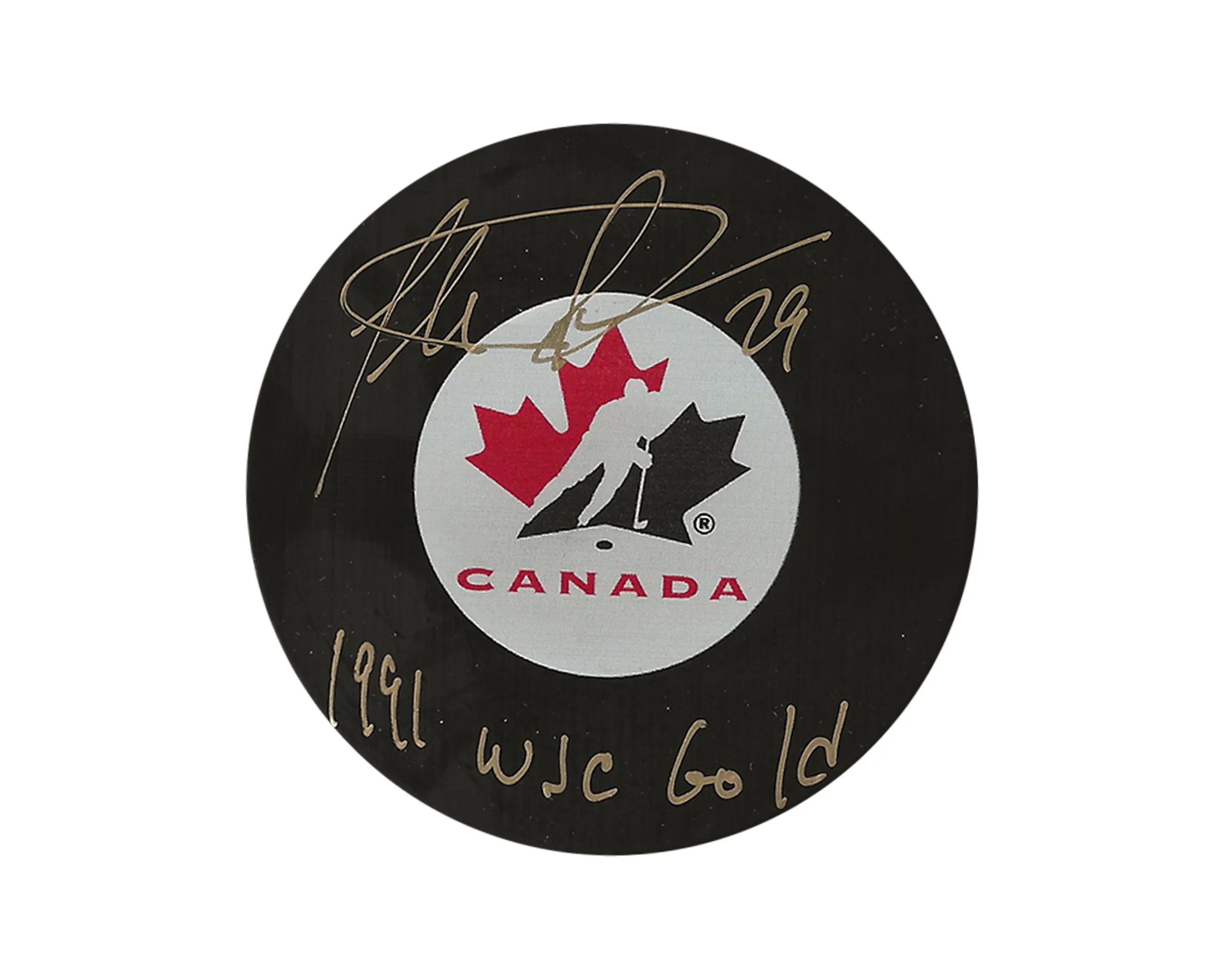Team Canada hockey puck with red maple leaf logo, gold signature, and '1991 WJC Gold' text.
