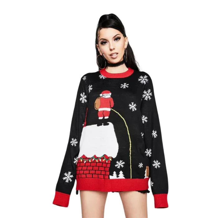 Woman wearing black Christmas sweater with Santa chimney and snowflake design