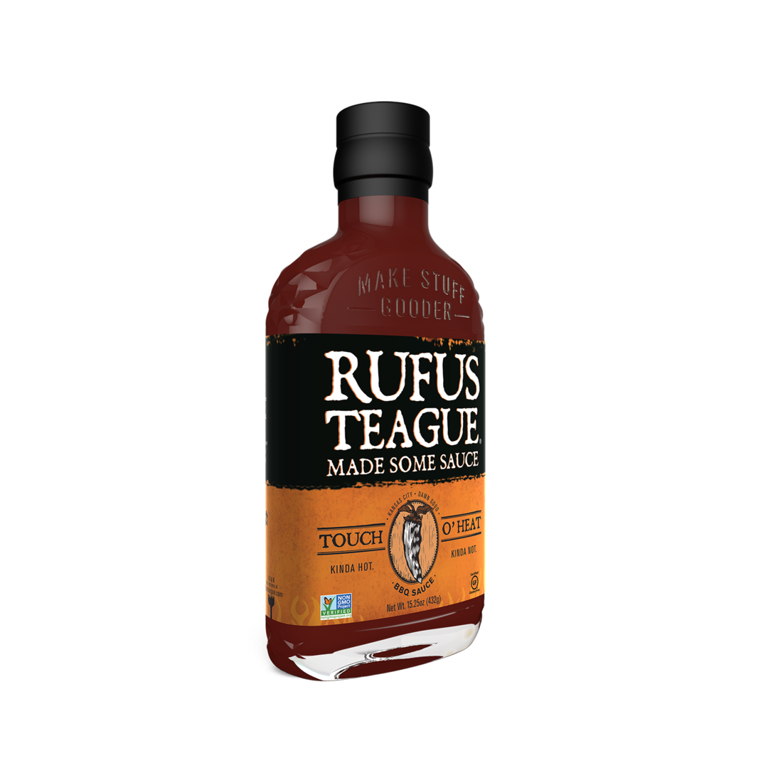 Rufus Teague Touch O' Heat BBQ sauce bottle on black background, spicy barbecue sauce