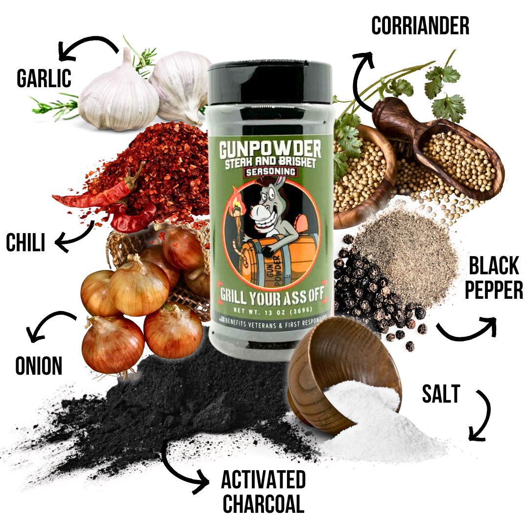 Gunpowder steak and brisket seasoning bottle surrounded by garlic, chili, onion, coriander, black pepper, salt, and activated charcoal ingredients.