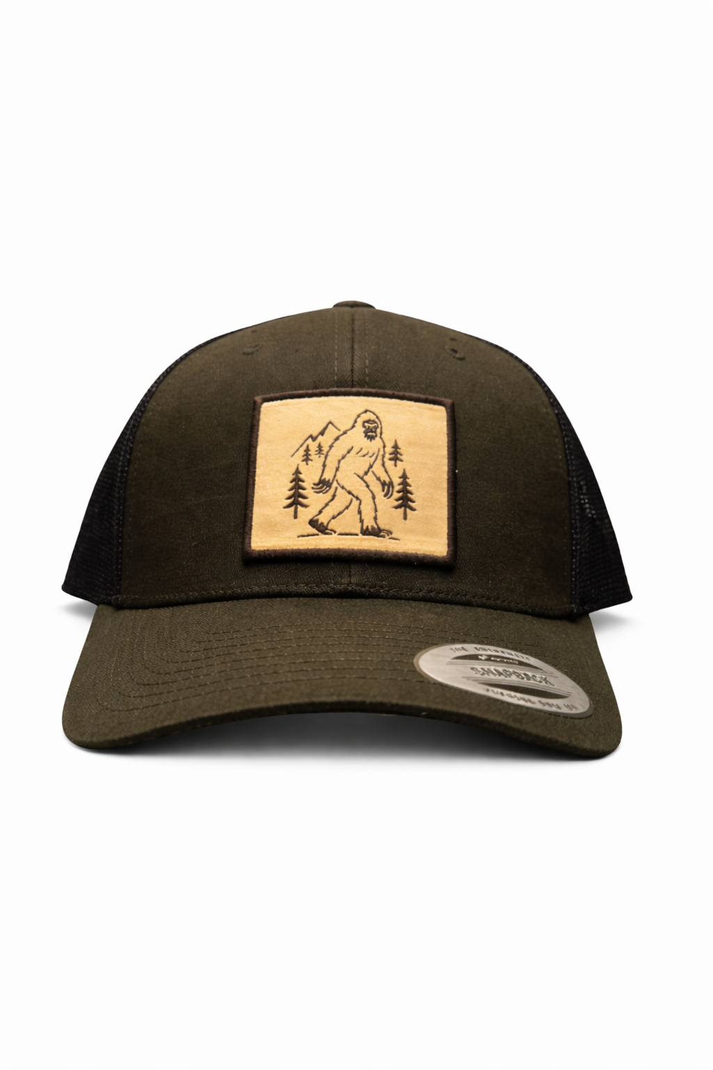 Olive green outdoor trucker hat with Bigfoot patch, trees and mountains, mesh back